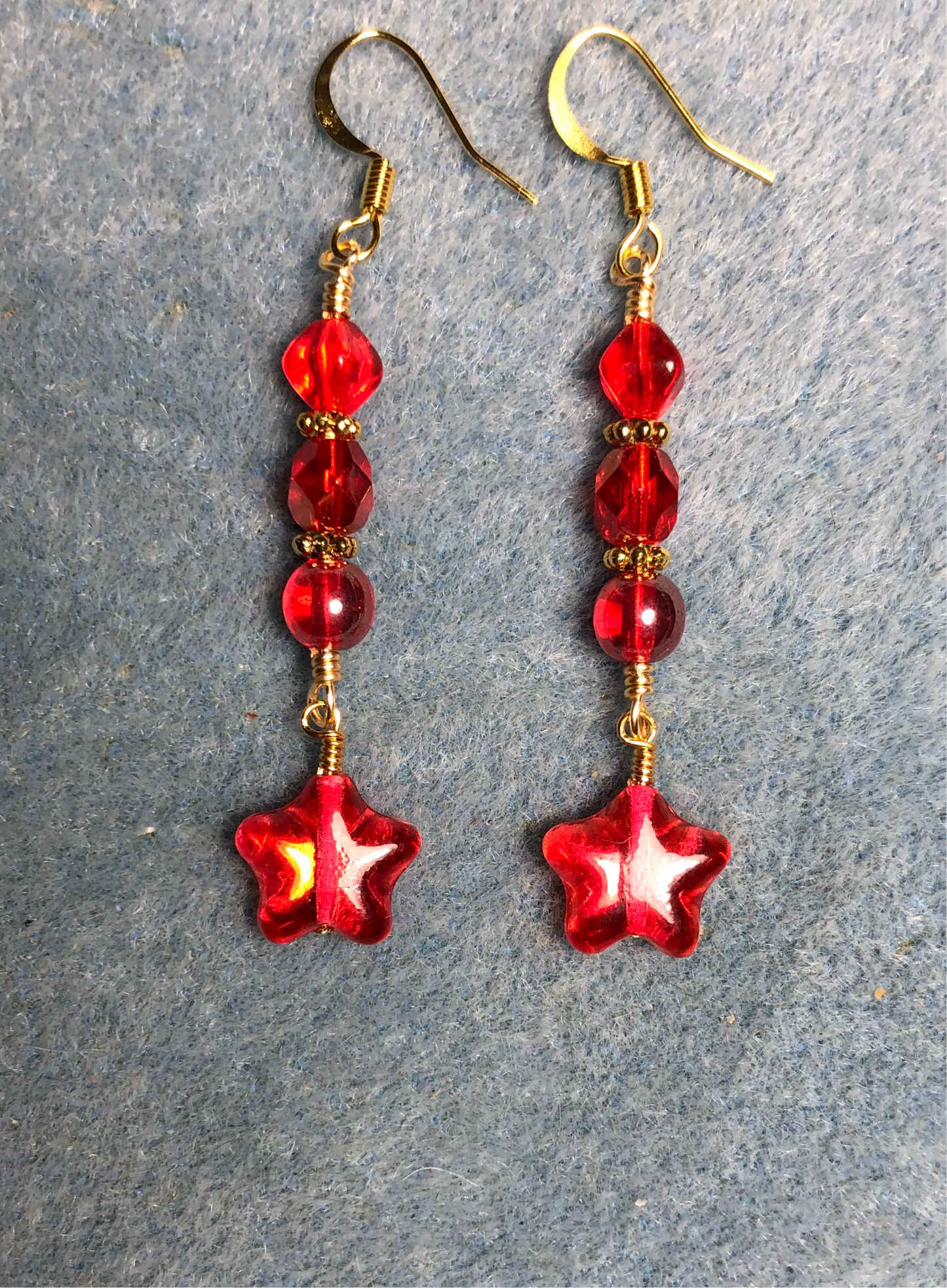 Small metallic red Czech glass star bead earrings adorned with bright red Czech glass beads.