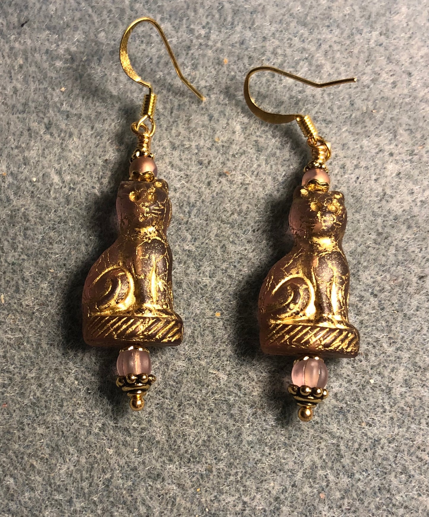 Translucent pink (with gold inlay) fancy Czech glass cat bead earrings adorned with light pink Czech glass beads.