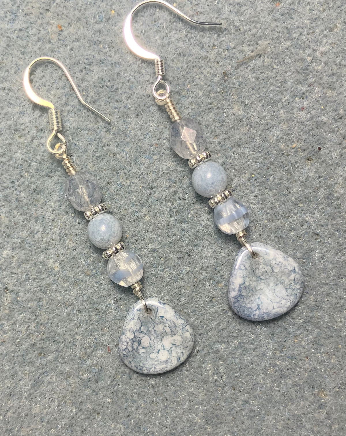 Light blue speckled Czech glass rose petal earrings adorned with light blue Czech glass beads.