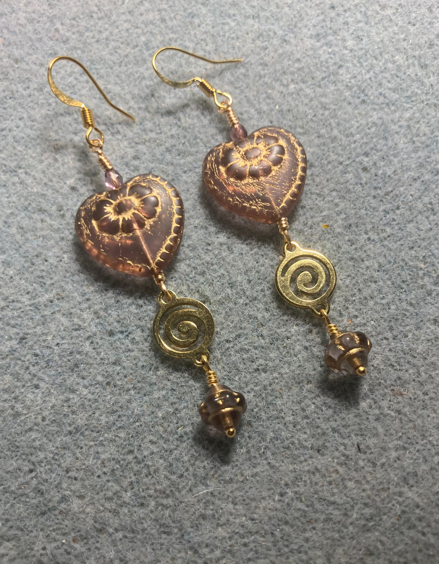 Violet (with gold inlay) Czech glass heart bead earrings adorned with gold swirly links and small violet Czech glass Saturn beads.