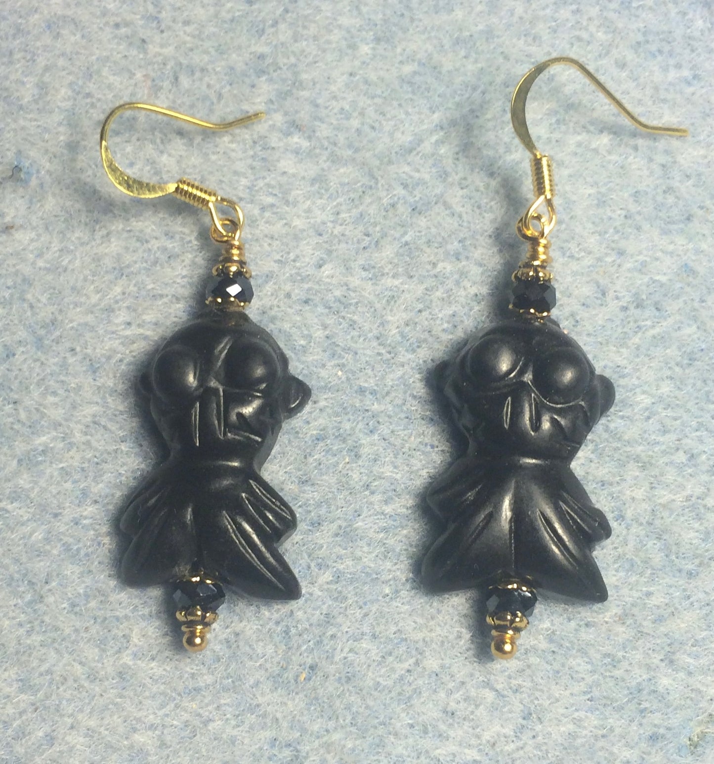 Carved black gemstone goldfish bead earrings adorned with black Chinese crystal beads.