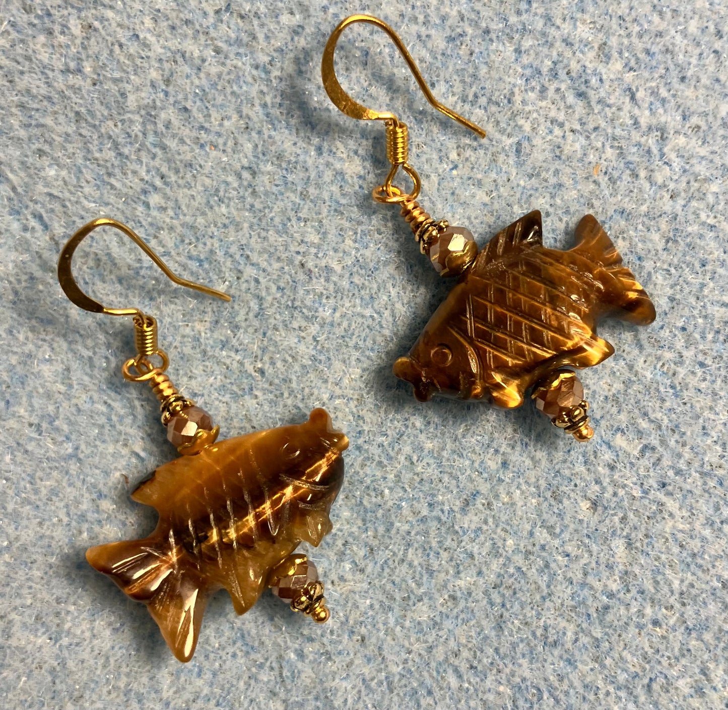 Brown tigereye jasper gemstone fish bead earrings adorned with brown Chinese crystal beads.