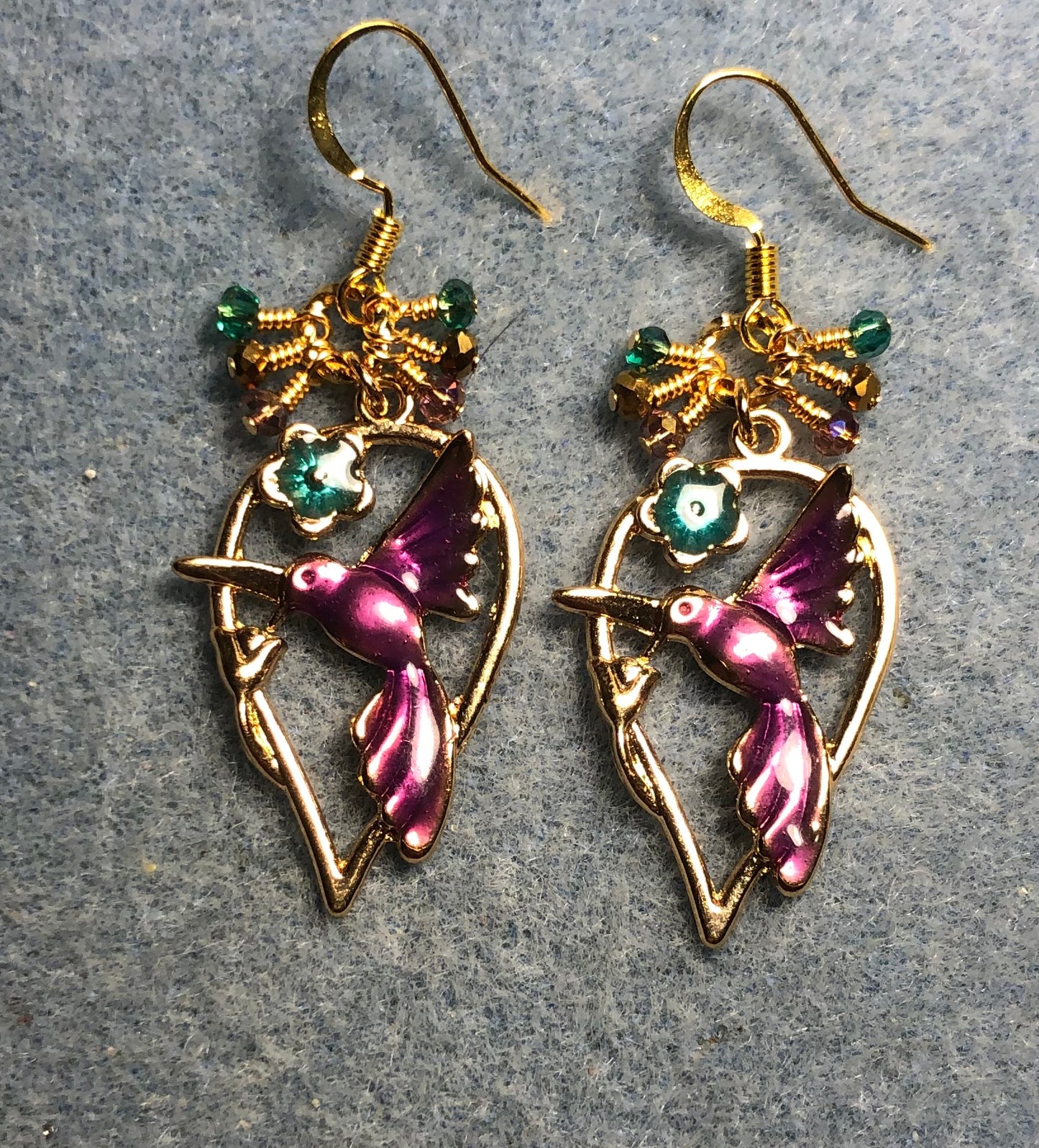 Purple, turquoise, and gold enamel hummingbird charm earrings adorned with tiny dangling purple, turquoise, and gold Chinese crystal beads.