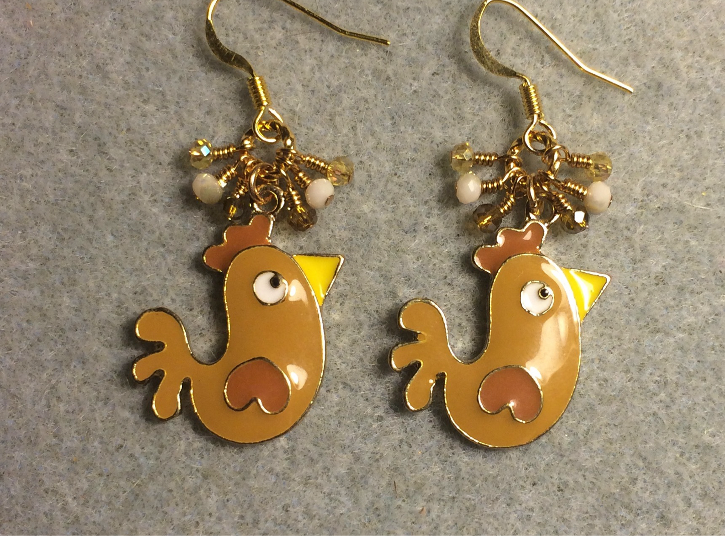 Brown, amber, and yellow enamel chicken charm earrings adorned with tiny dangling brown, amber, and yellow Chinese crystal beads.