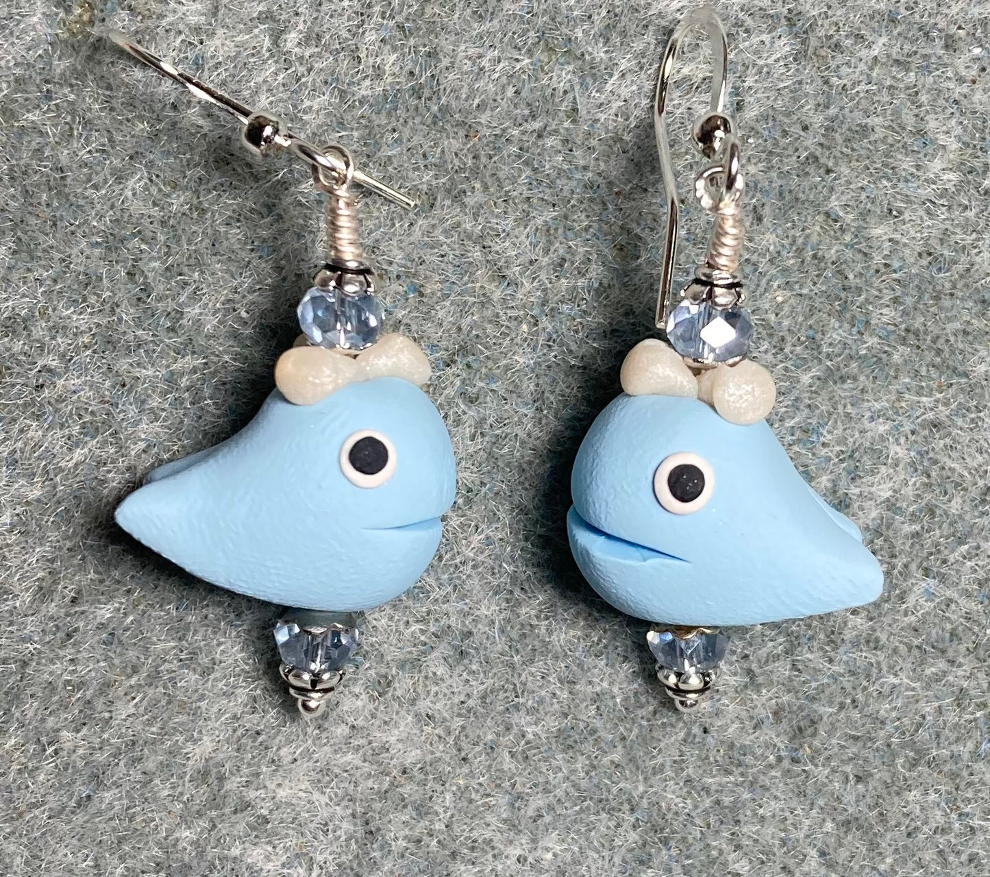Light blue and white polymer clay whale bead earrings adorned with light blue Chinese crystal beads.