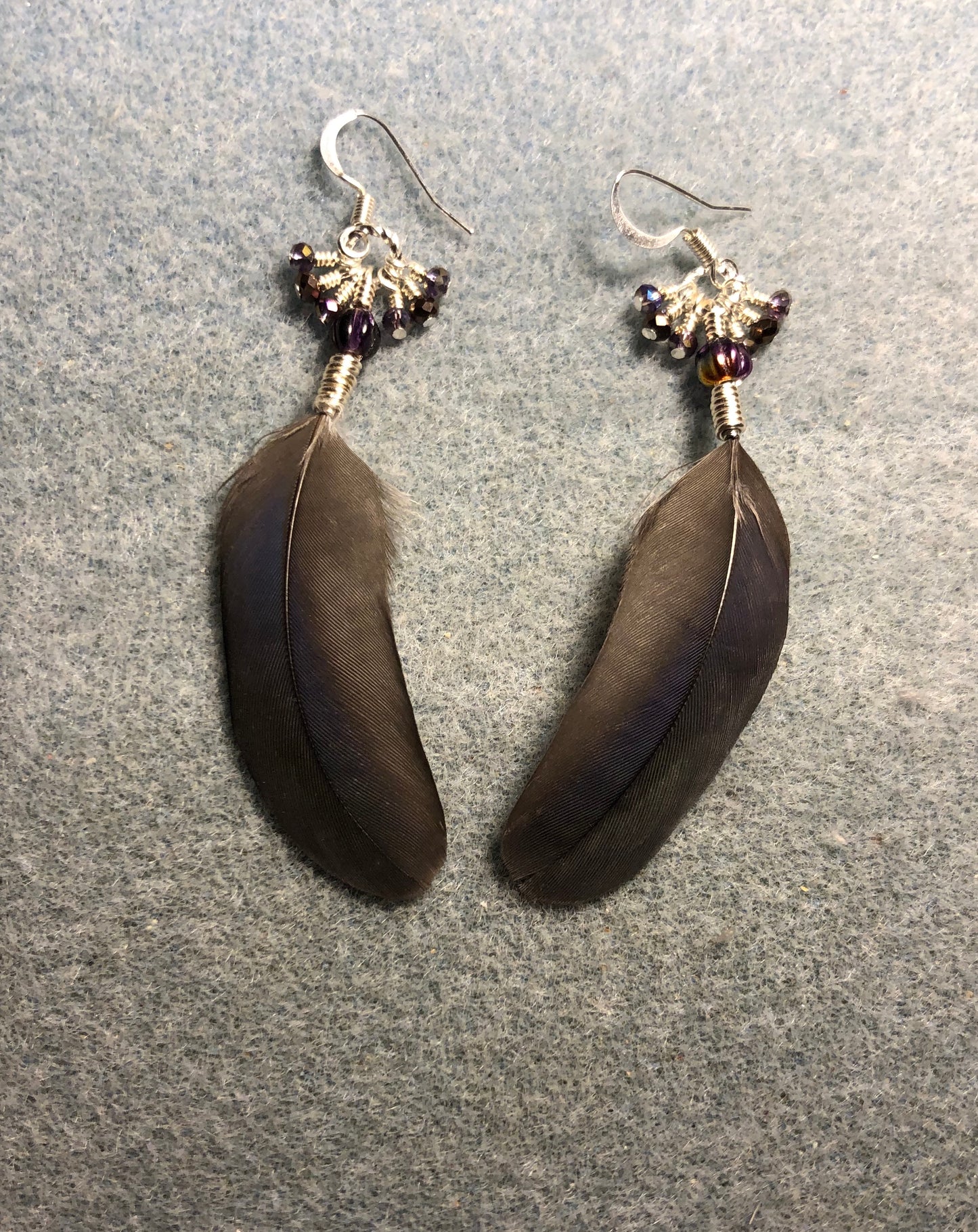 Purple and bronze Pionus parrot feather earrings adorned with purple Czech glass beads and tiny dangling purple and bronze Chinese crystal beads.