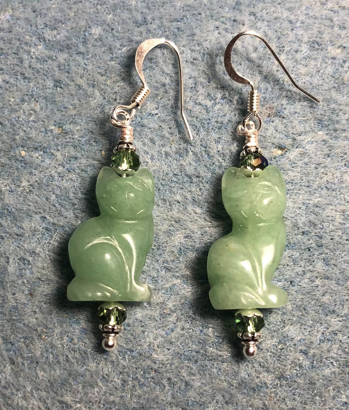 Light green aventurine gemstone cat bead earrings adorned with light green Chinese crystal beads.