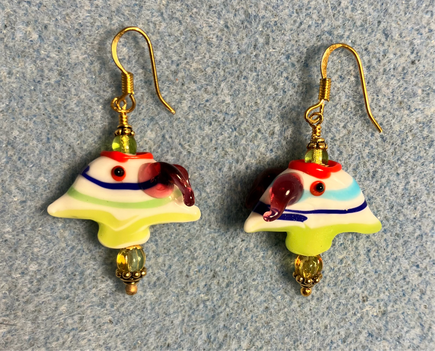 Olive green, dark blue, purple, and red lamp work striped angelfish bead earrings adorned with olive green Czech glass beads.