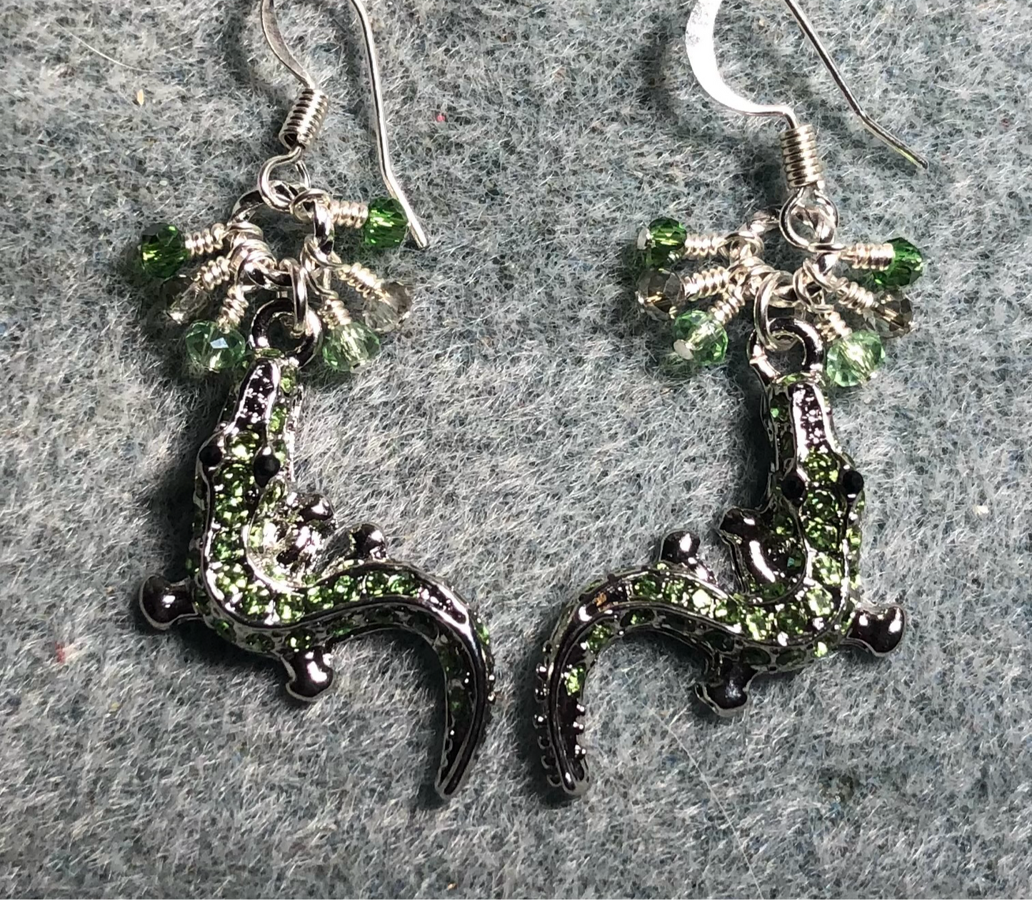 Silver and green rhinestone alligator charm earrings adorned with tiny dangling green and silver Chinese crystal beads.