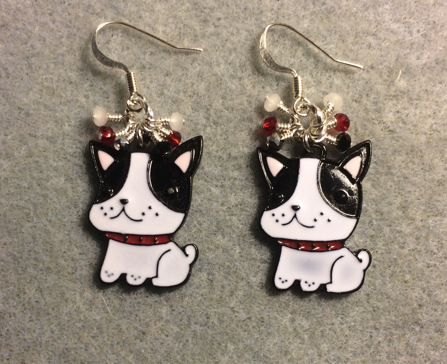 Black and white enamel Boston Terrier charm earrings adorned with tiny dangling black, white, and red Chinese crystal beads.
