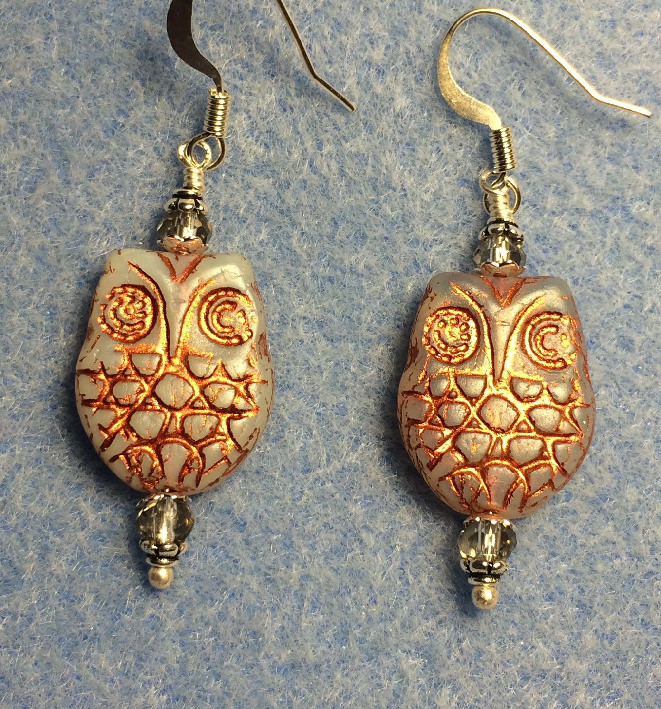 Gray (with copper wash) Czech glass owl bead earrings adorned with gray Chinese crystal beads.