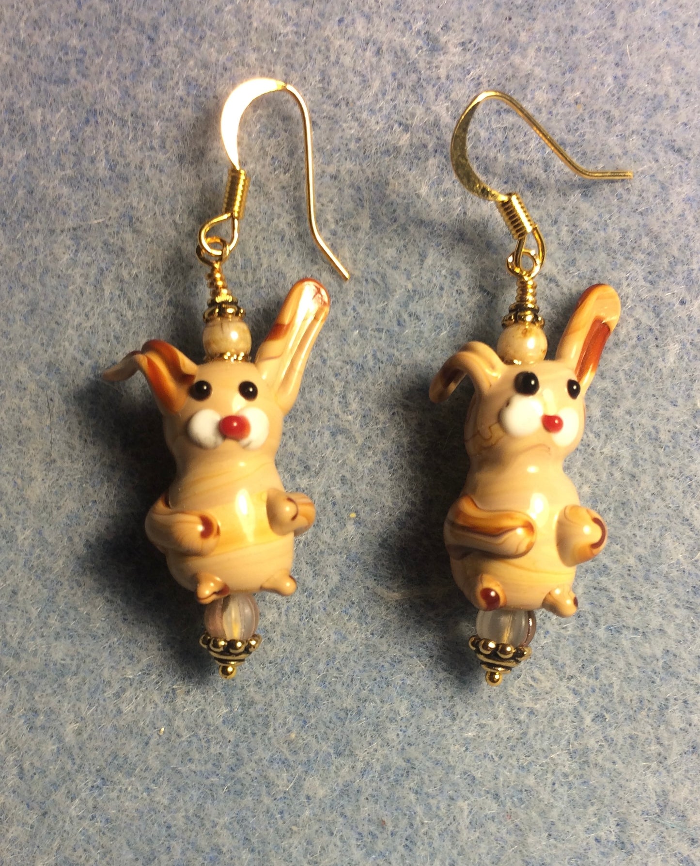 Tan lamp work bunny rabbit bead earrings adorned with tan Czech glass beads.
