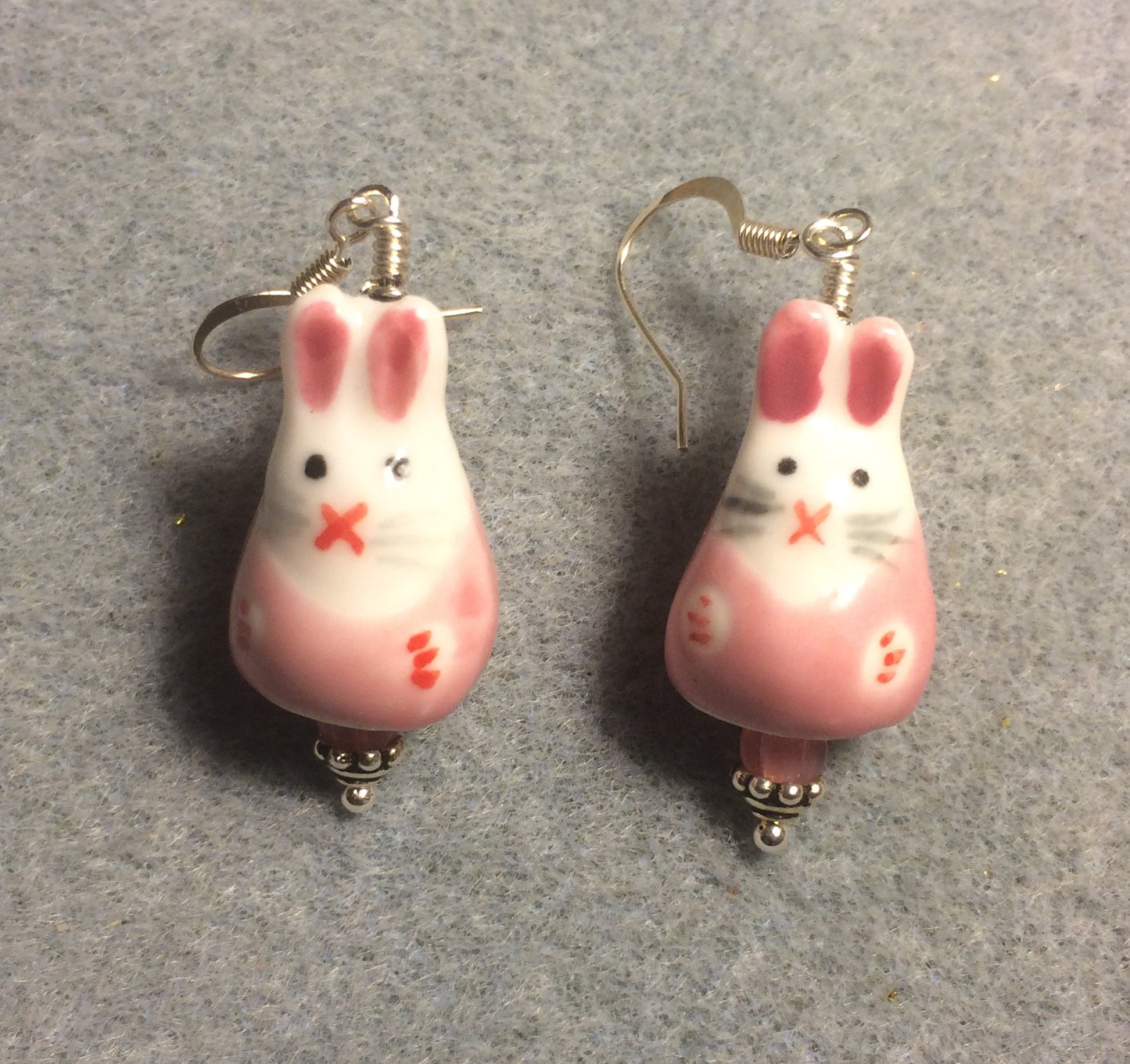 Pink and white ceramic bunny rabbit bead earrings adorned with pink Czech glass beads.