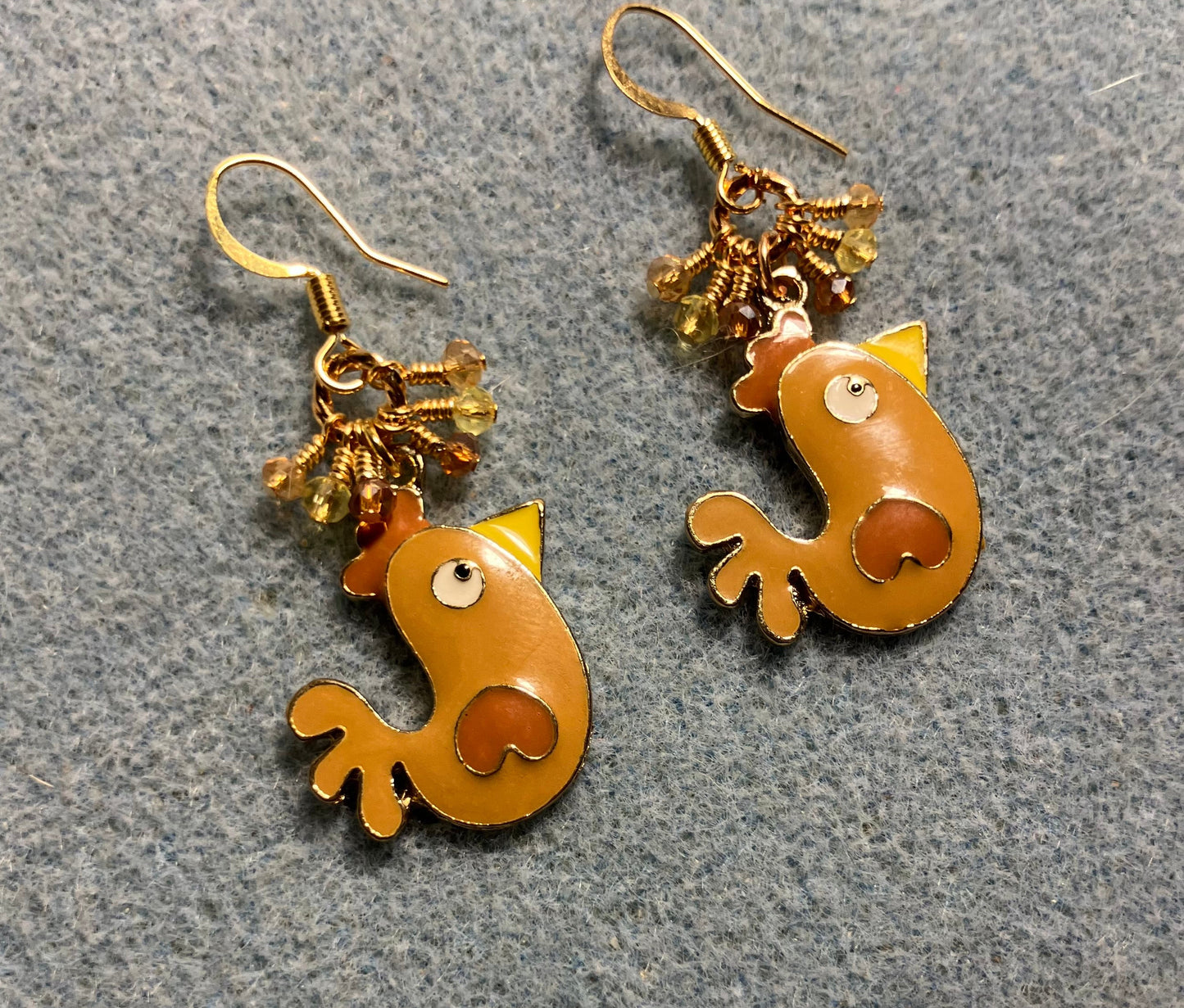 Brown, amber, and yellow enamel chicken charm earrings adorned with tiny dangling brown, amber, and yellow Chinese crystal beads.