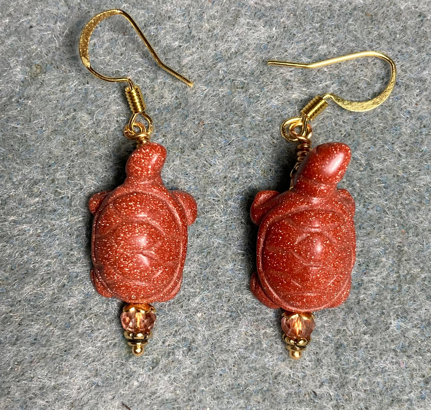 Orange goldstone gemstone turtle bead earrings adorned with orange Chinese crystal beads.