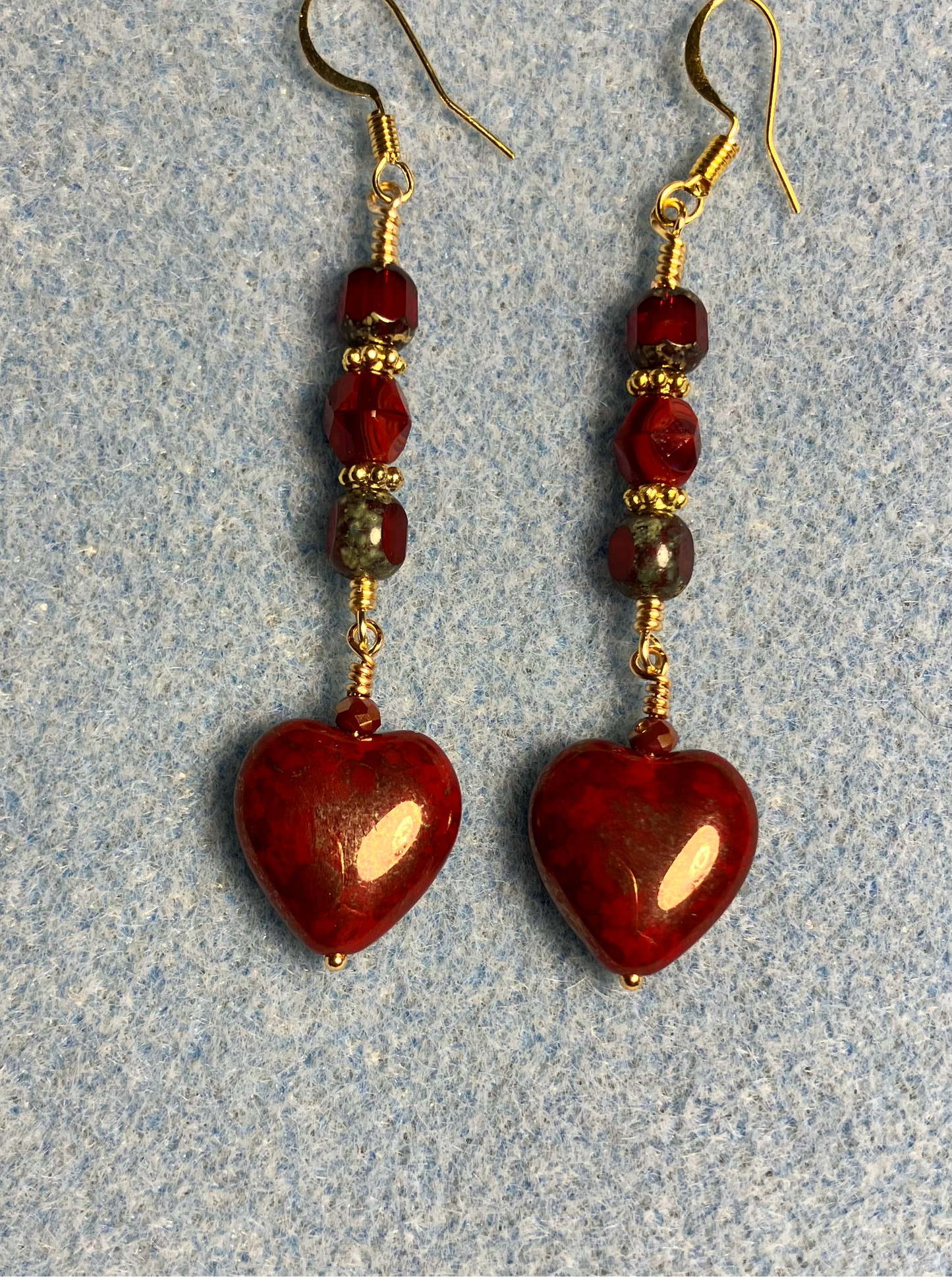 Blood red Czech glass heart bead earrings adorned with blood red Czech glass beads.