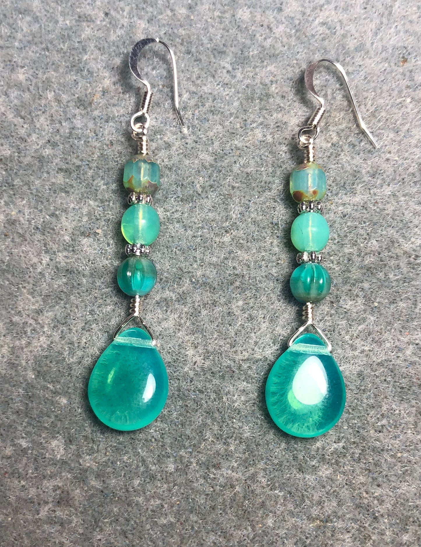 Milky turquoise Czech glass pear drop bead earrings adorned with milky turquoise Czech glass beads.