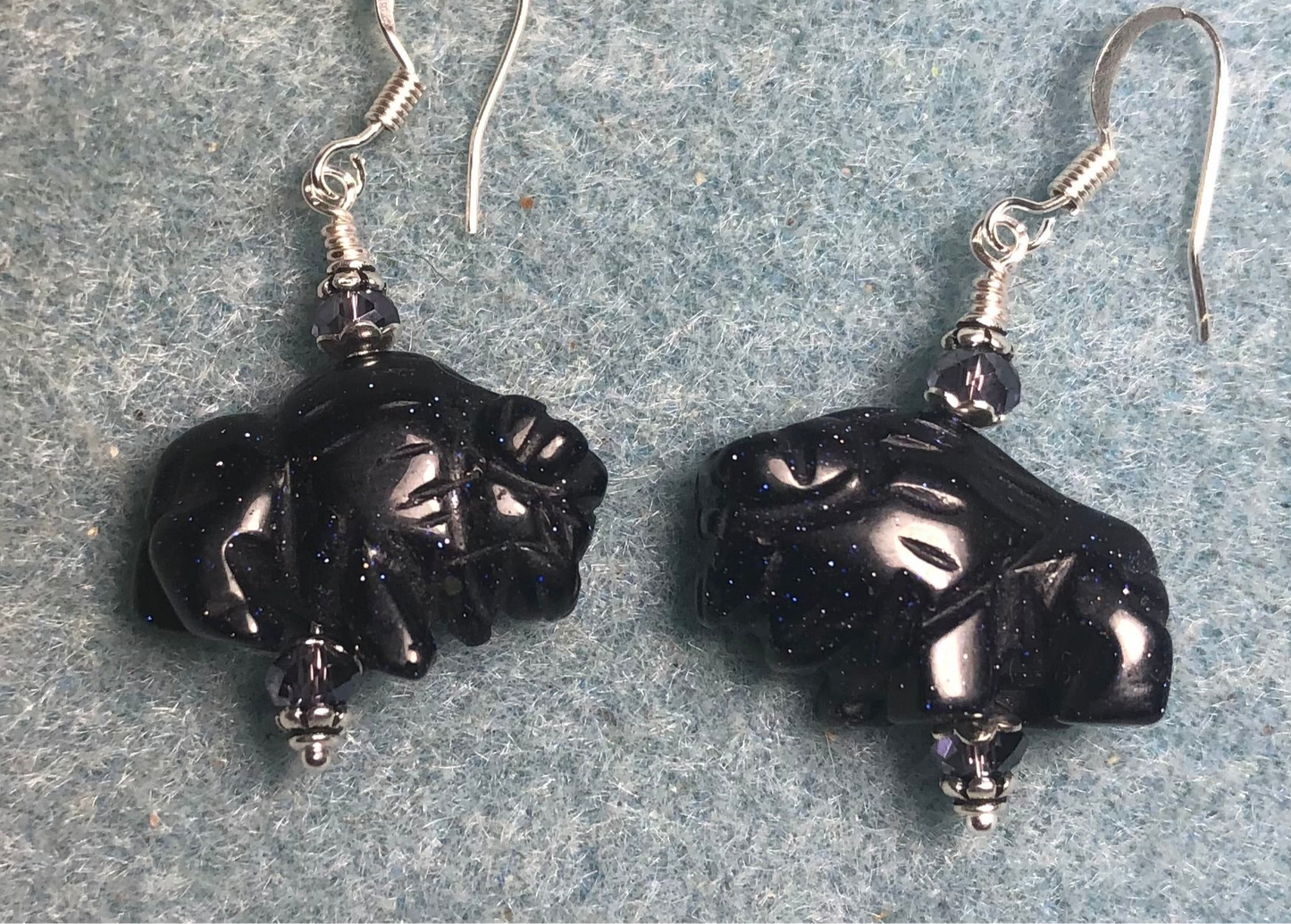 Blue goldstone gemstone buffalo bead earrings adorned with purple Chinese crystal beads.