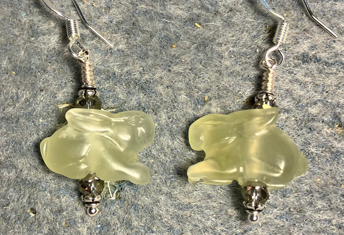 Light green new jade gemstone Zuni rabbit bead earrings adorned with sparkly light green Chinese crystal beads.
