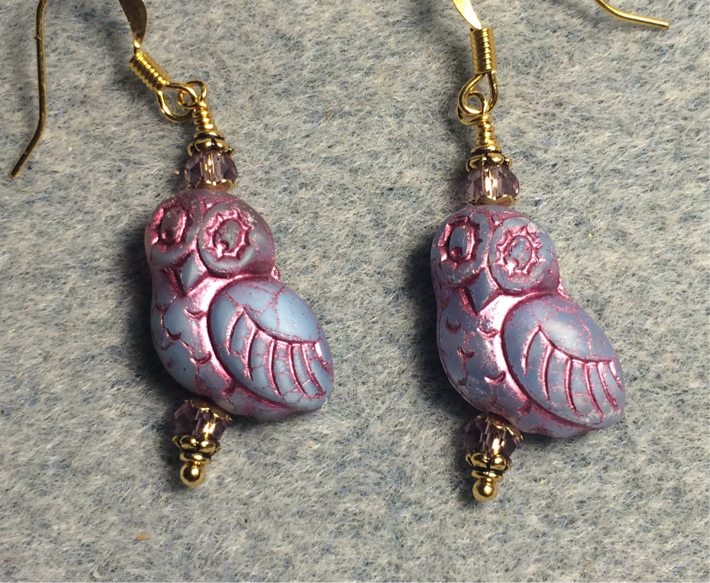 Lavender (with pink wash) fancy Czech glass owl bead earrings adorned with lavender Chinese crystal beads.