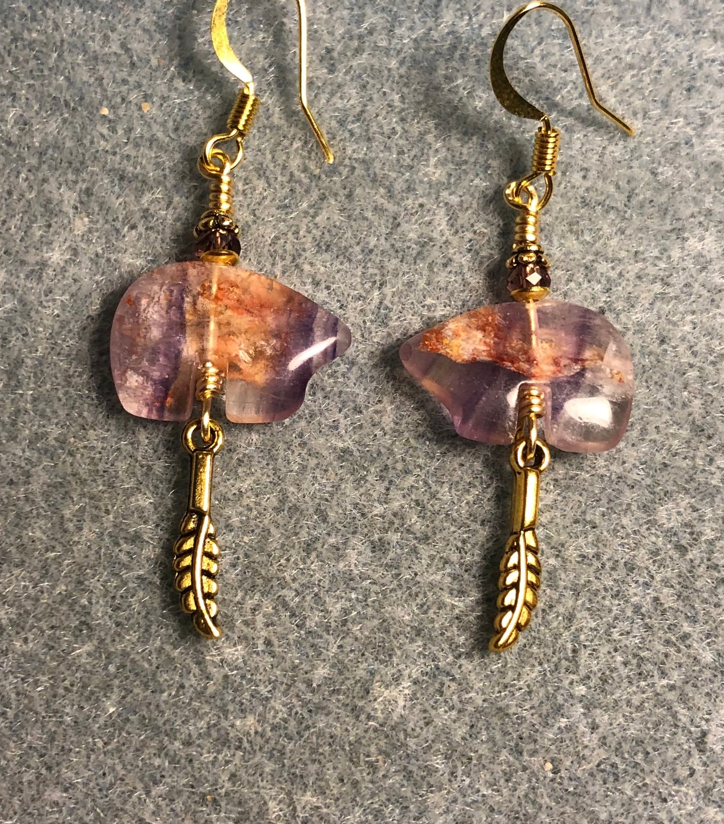 Purple and orange fluorite gemstone Zuni bear fetish bead earrings adorned with purple crystal beads and tiny gold feather charms.