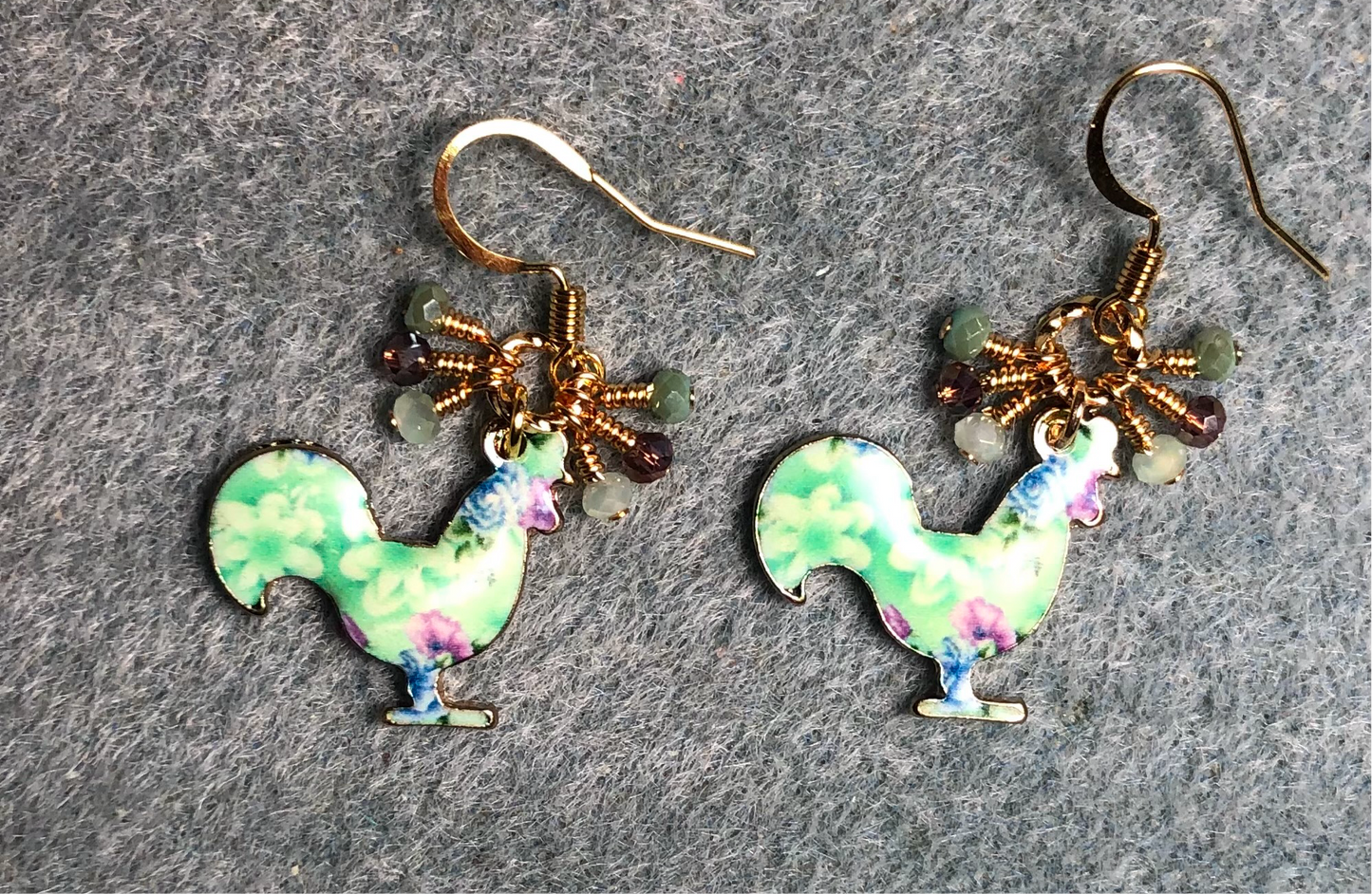 Aqua and violet enamel rooster charm earrings adorned with tiny dangling aqua and violet Chinese crystal beads.