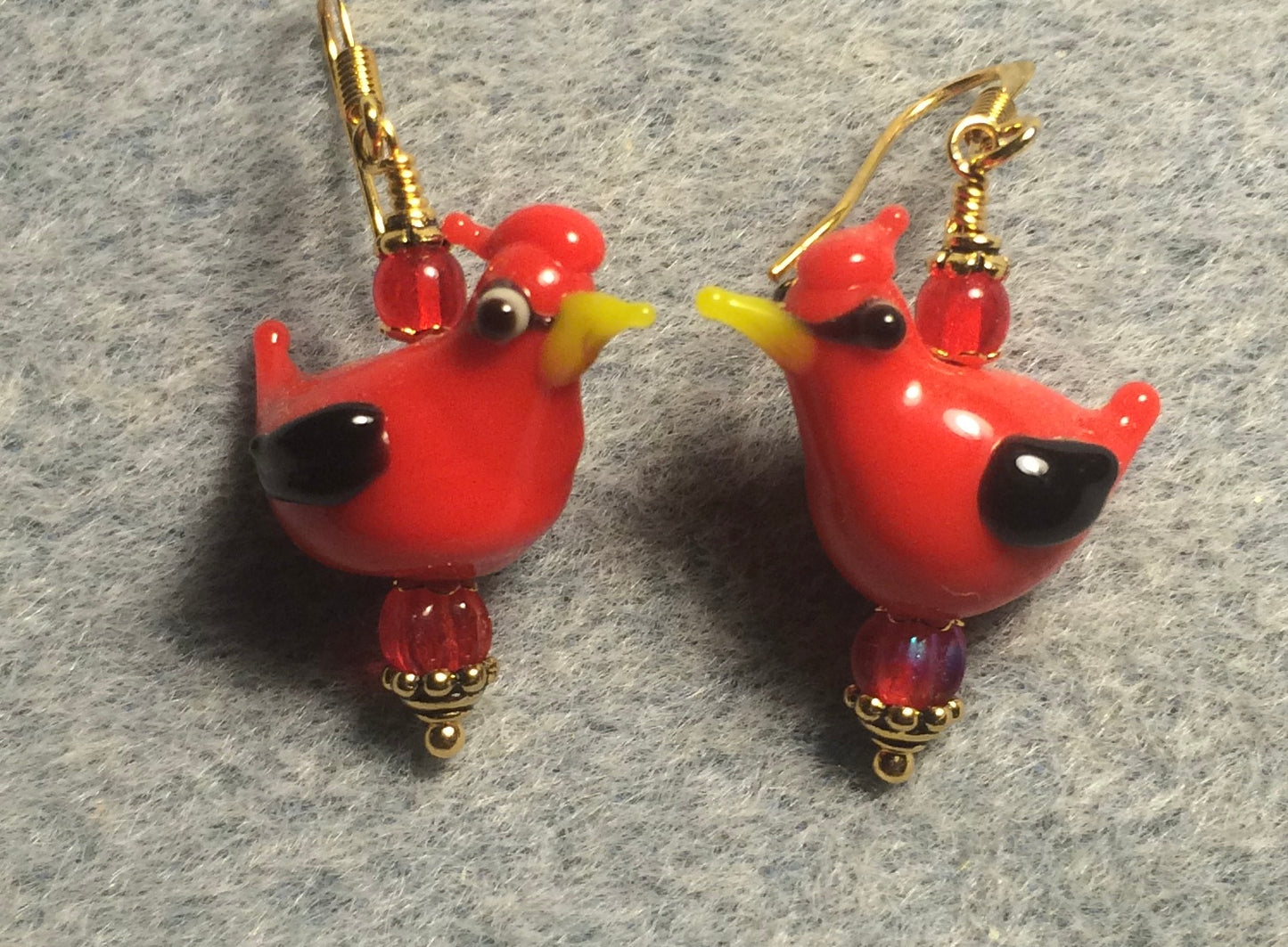 Opaque red lamp work cardinal bead earrings adorned with red Czech glass beads.
