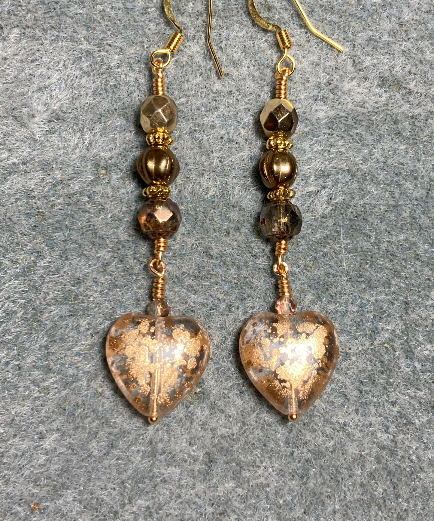 Sparkly gold Czech glass heart bead earrings adorned with gold Czech glass beads.