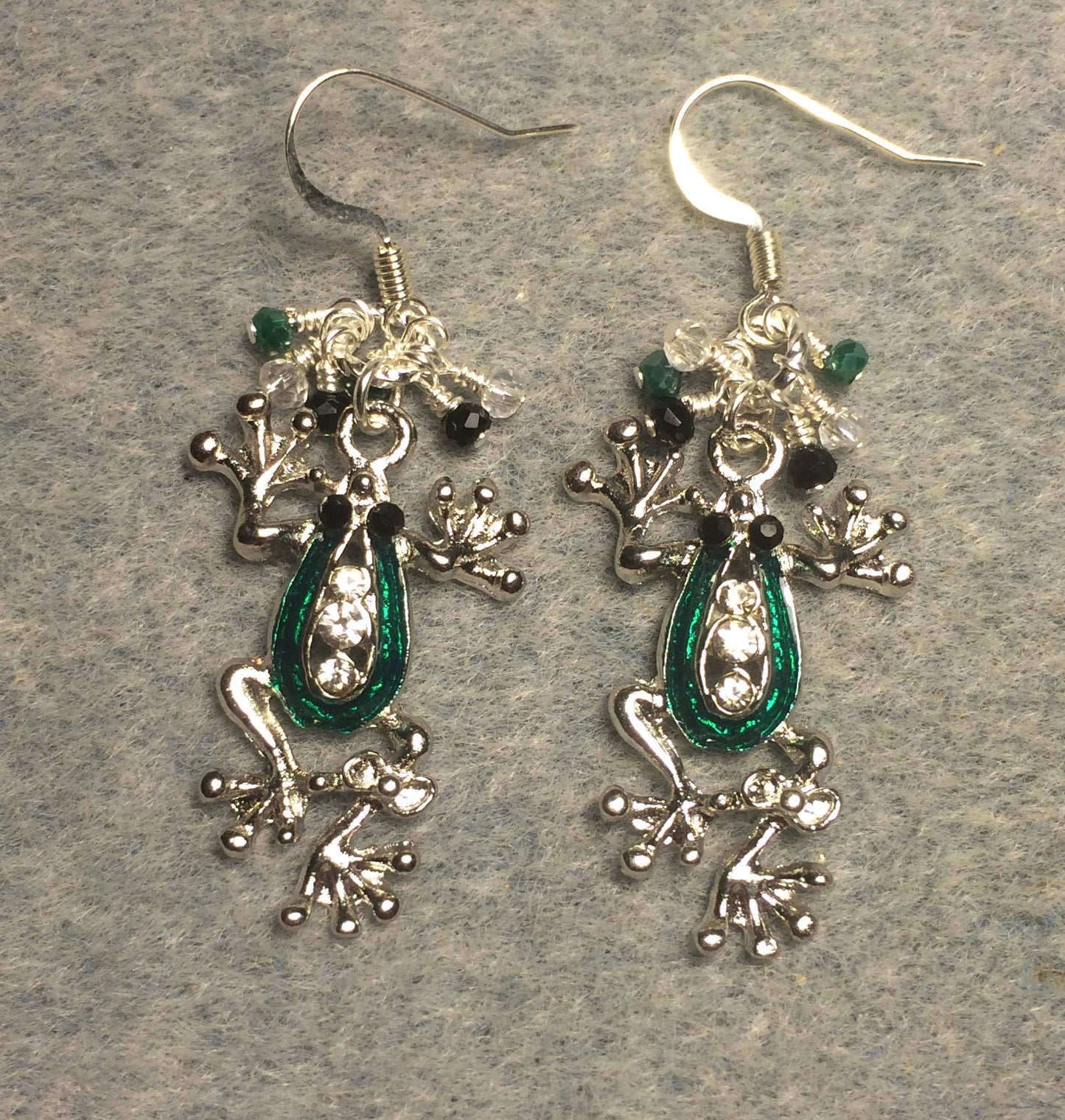 Silver and green enamel and rhinestone frog charm earrings adorned with tiny dangling green, clear, and black Chinese crystal beads.