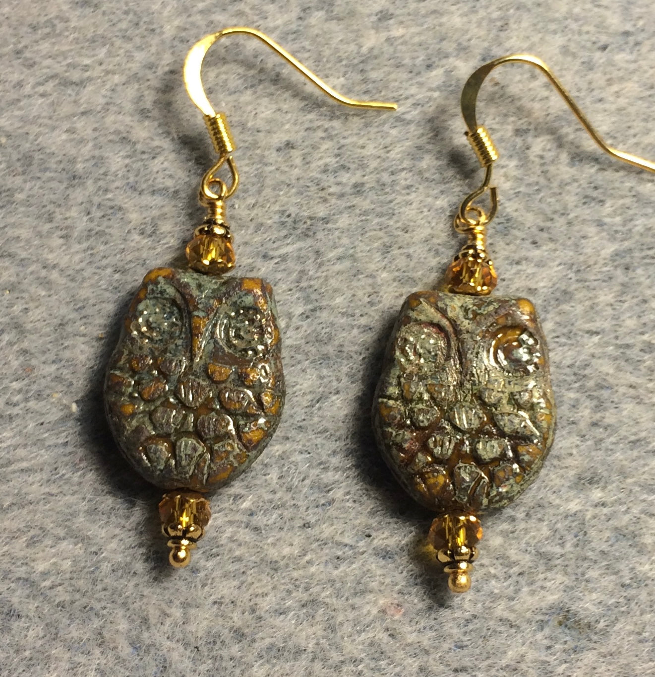 Green and topaz Czech glass owl bead earrings adorned with topaz Chinese crystal beads.