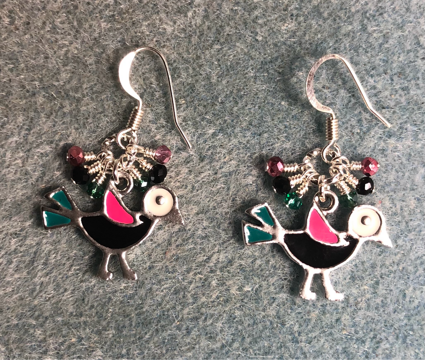Black, pink, and teal enamel bird charm earrings adorned with tiny dangling black, pink, and teal Chinese crystal beads.