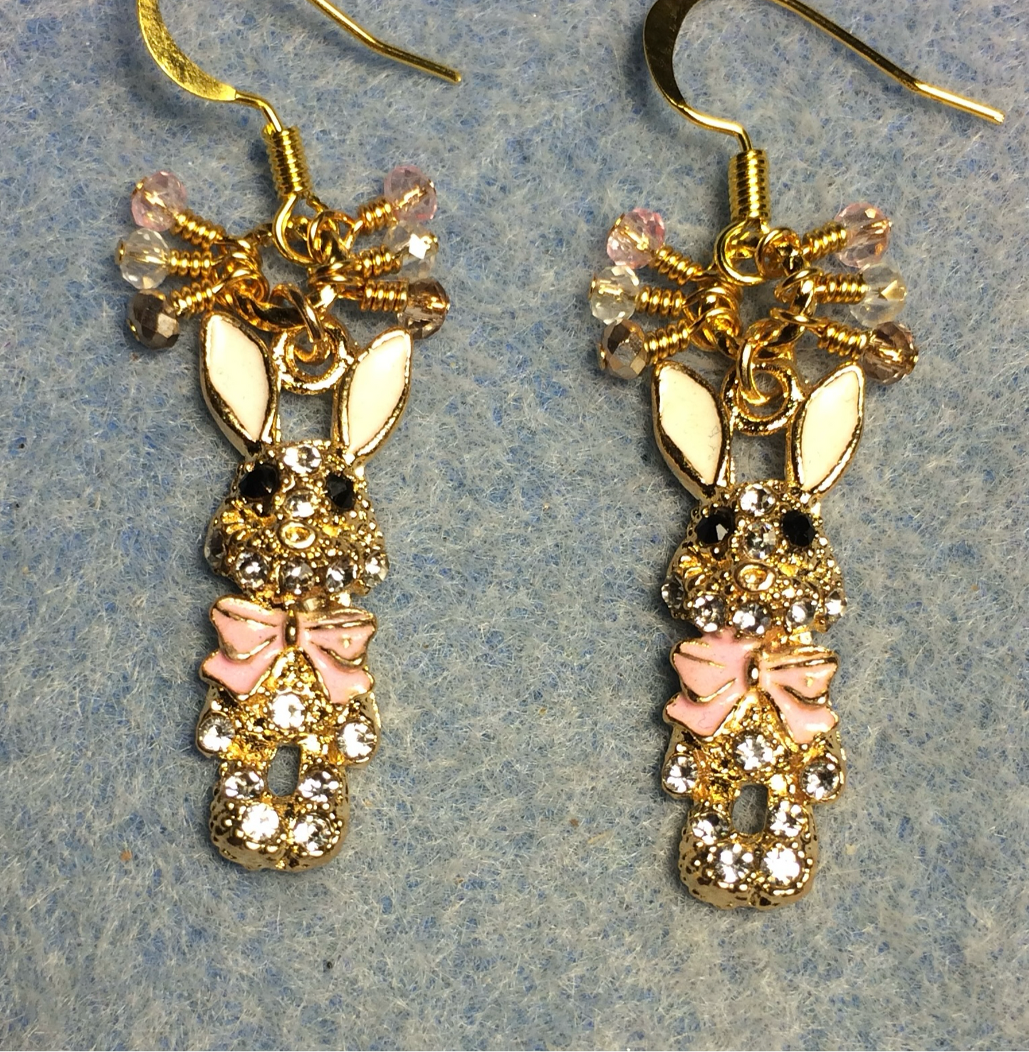 Gold, white, and pink enamel and rhinestone rabbit charm earrings adorned with gold, clear, and pink Chinese crystal beads.