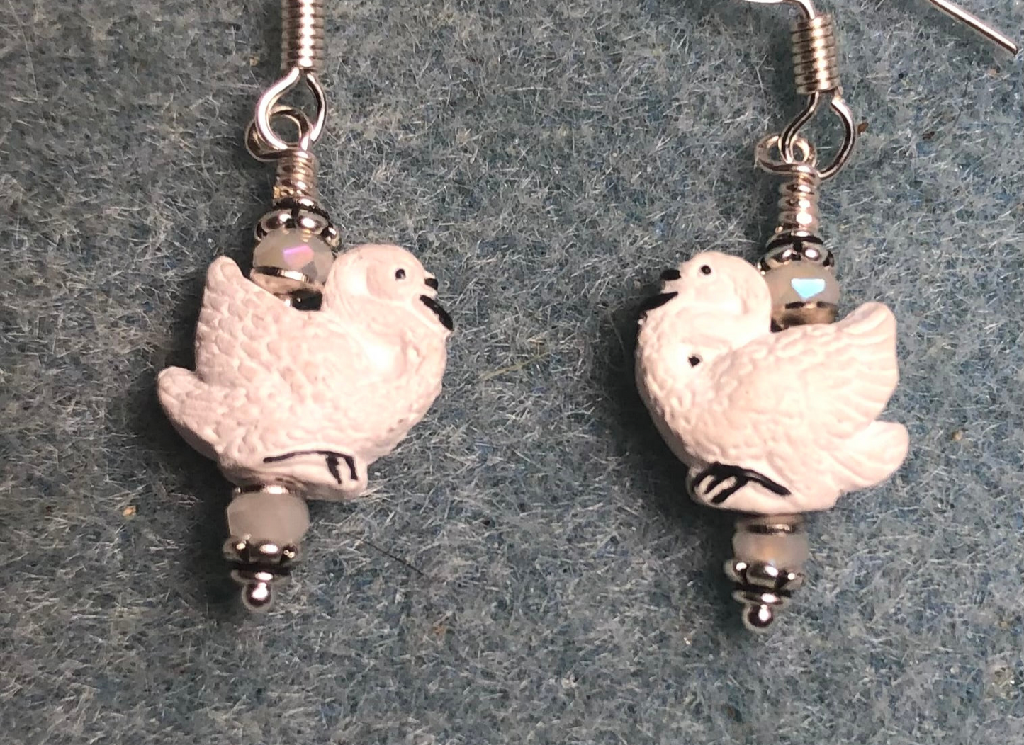 Small white ceramic swan bead earrings adorned with white Chinese crystal beads.