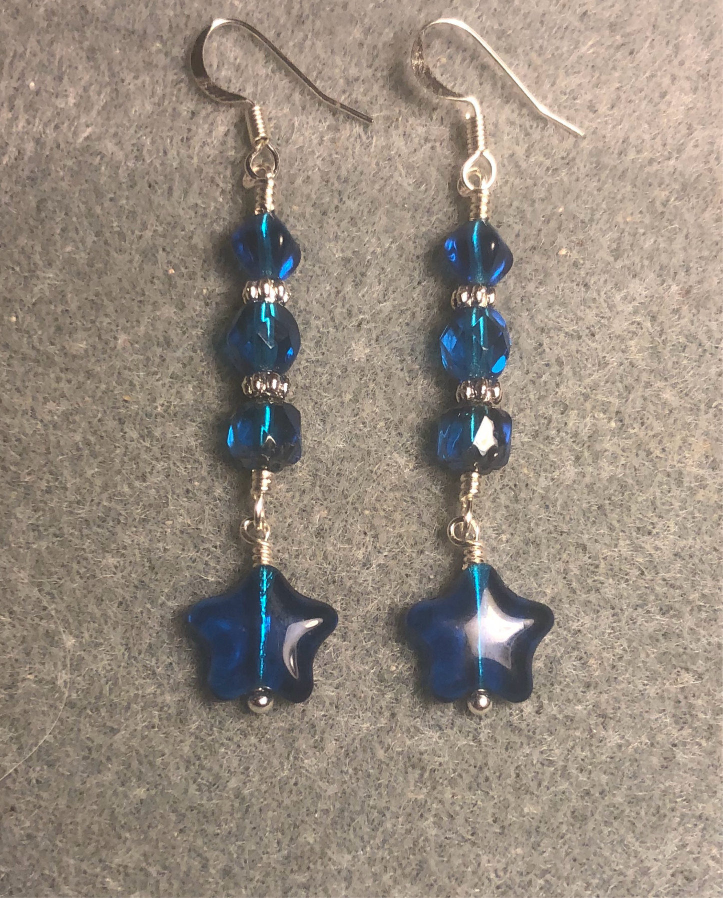 Small bright blue turquoise Czech glass star bead earrings adorned with bright blue turquoise Czech glass beads.