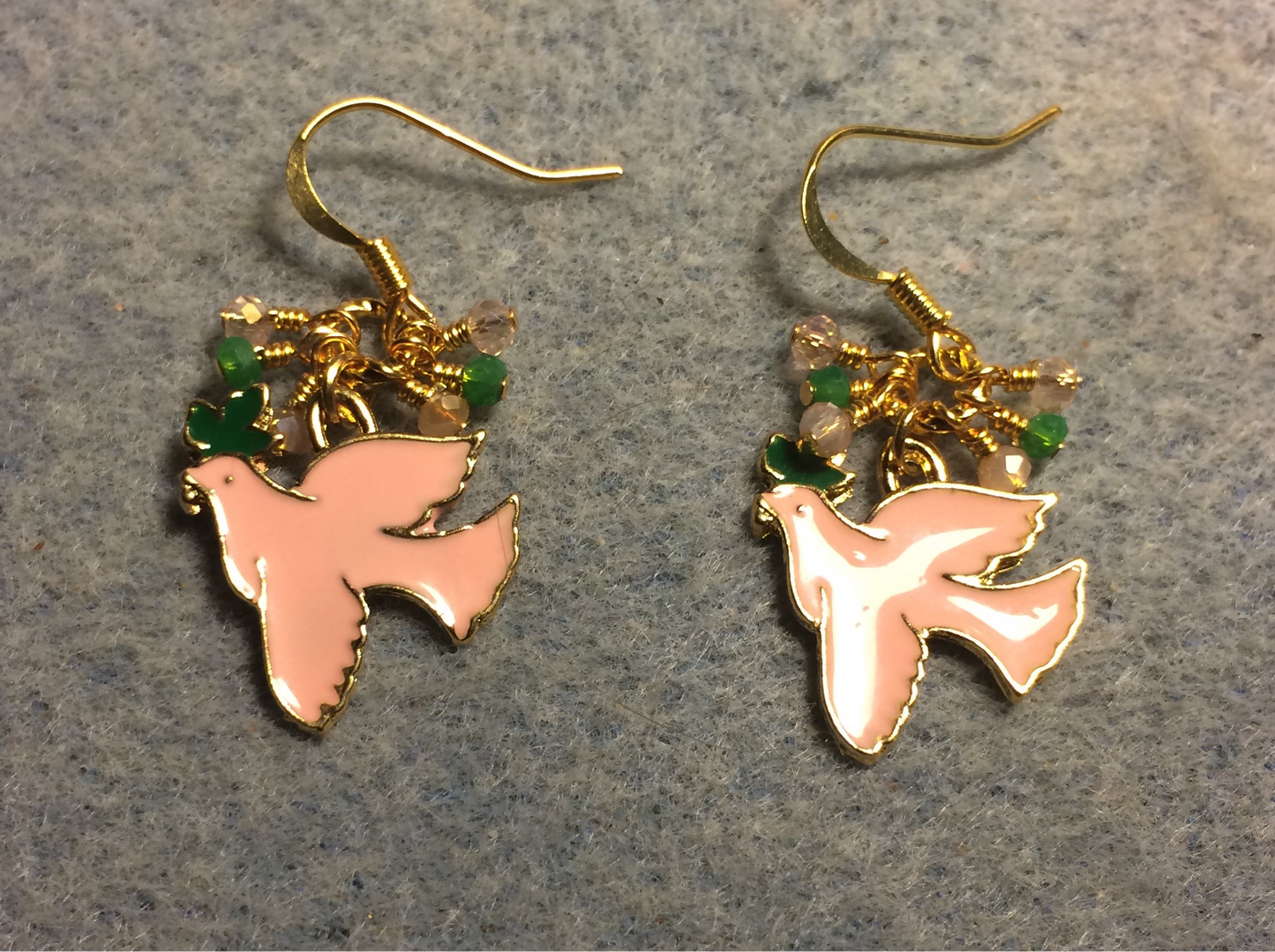 Peach, green, and gold enamel dove charm earrings adorned with tiny dangling peach and green Chinese crystal beads.