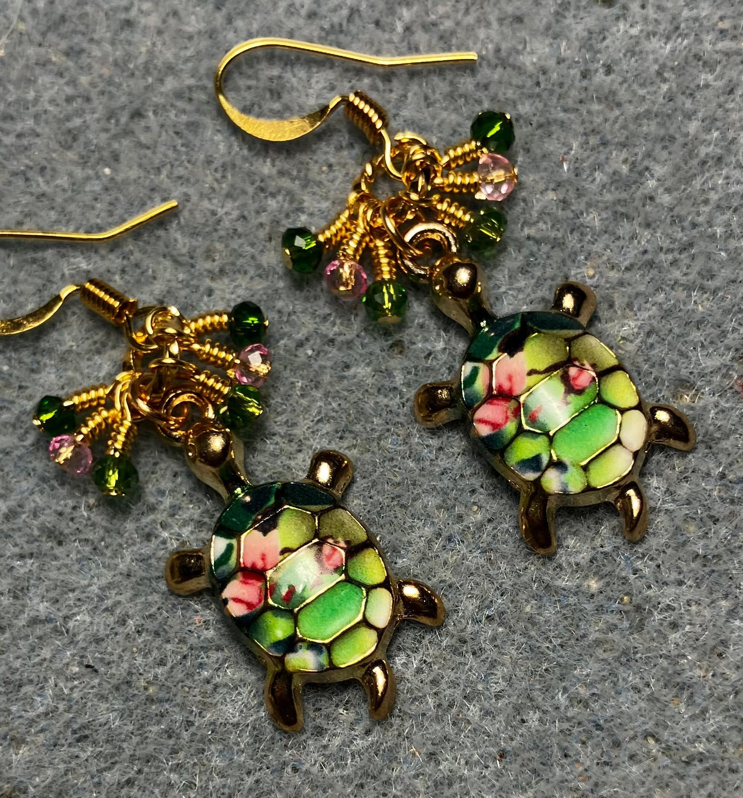 Green and pink enamel turtle charm earrings adorned with tiny dangling green and pink Chinese crystal beads.