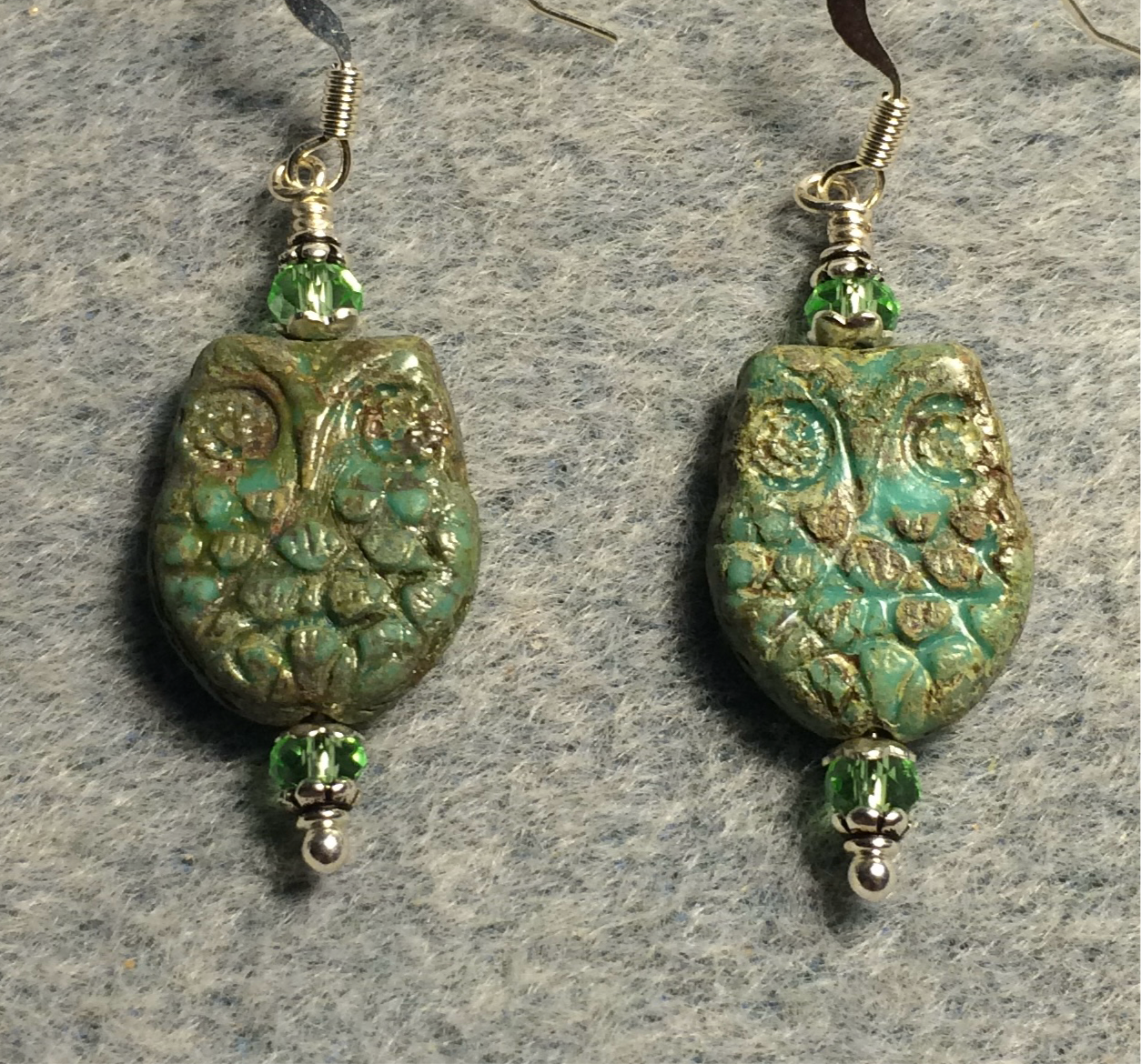 Light green (with Picasso wash) Czech glass owl bead earrings adorned with light green Chinese crystal beads.