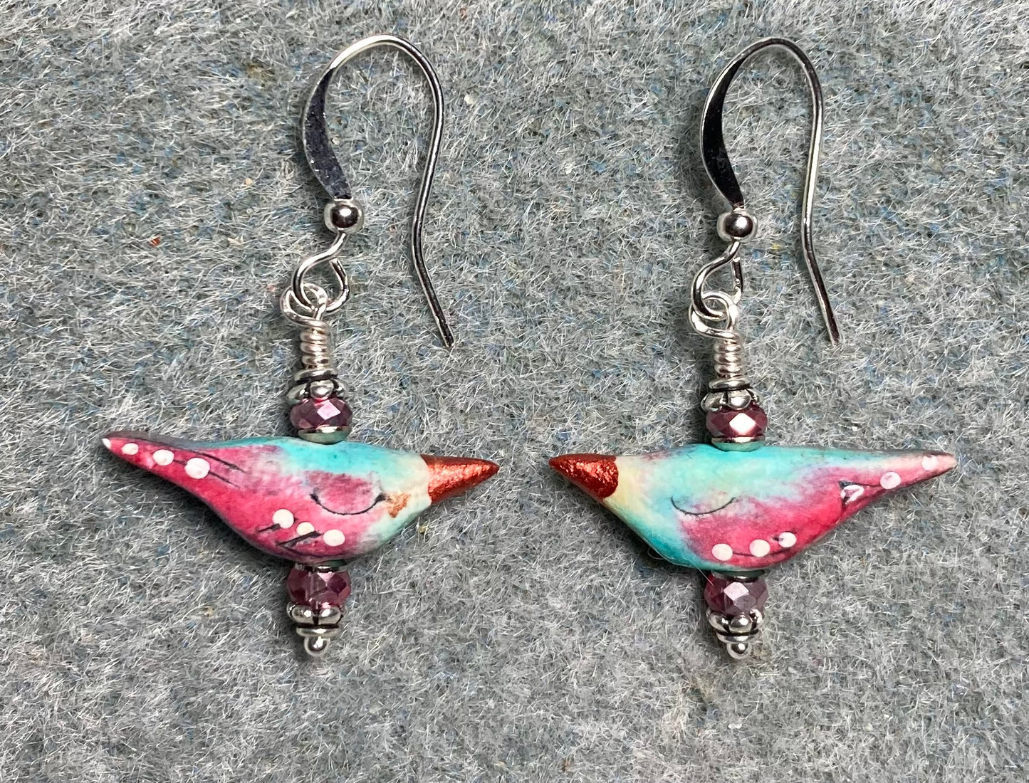 Small rose pink and turquoise polymer clay bird bead earrings adorned with rose pink Chinese crystal beads.