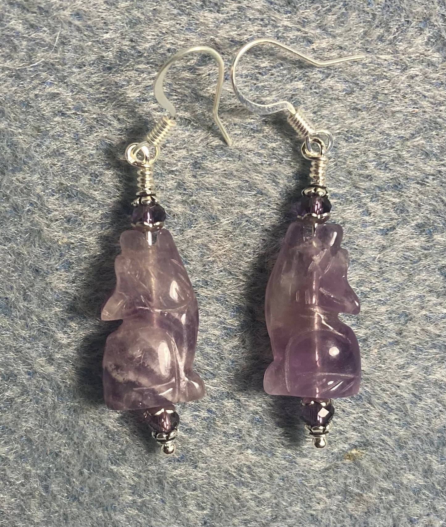 Amethyst gemstone howling coyote bead earrings adorned with purple Chinese crystal beads.