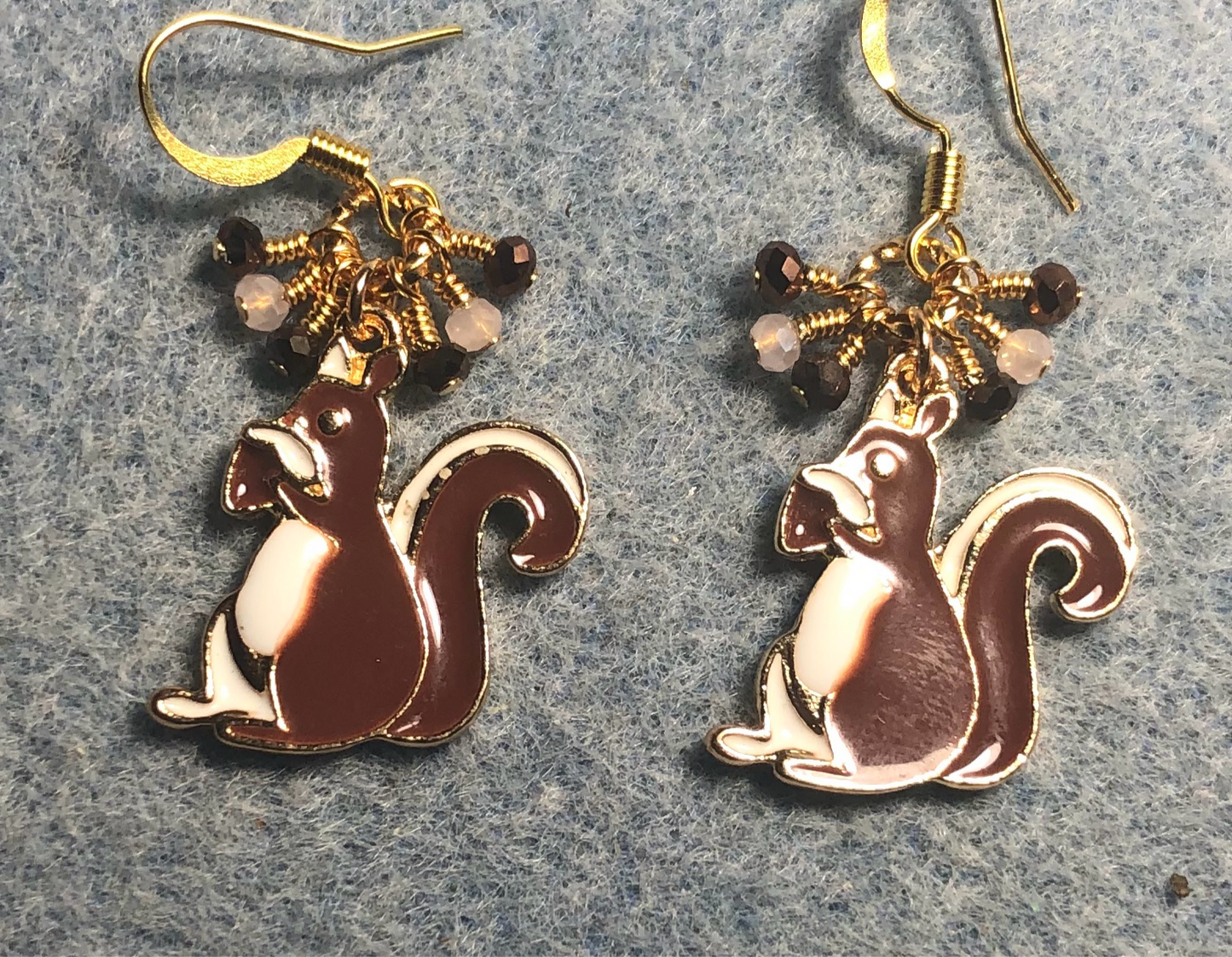 Brown and white enamel squirrel charm earrings adorned with brown and white Chinese crystal beads.