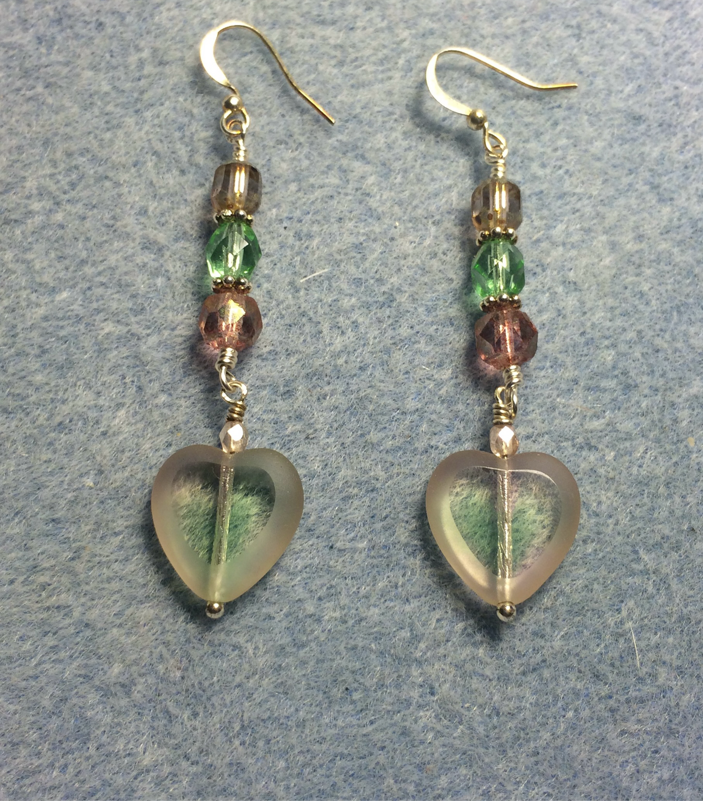 Light green and light pink Czech glass heart bead earrings adorned with light green and light pink Czech glass beads.