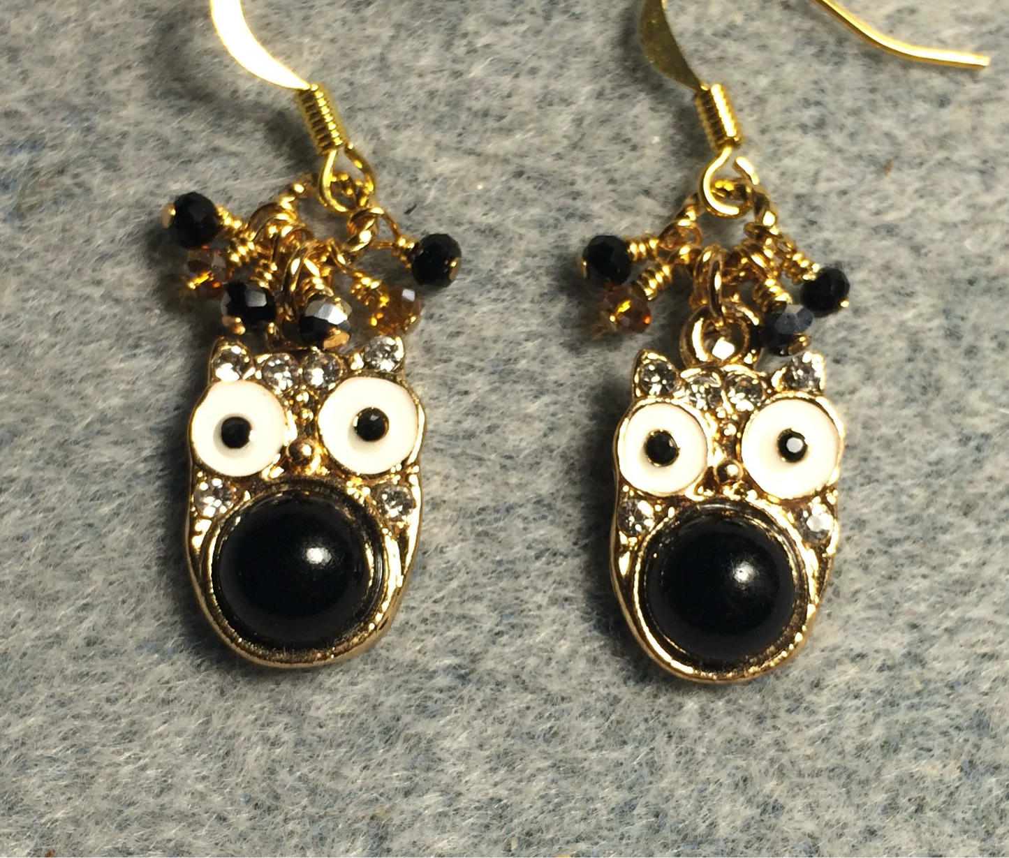 Black and white enamel and rhinestone owl charm earrings adorned with tiny dangling black and amber Chinese crystal beads.