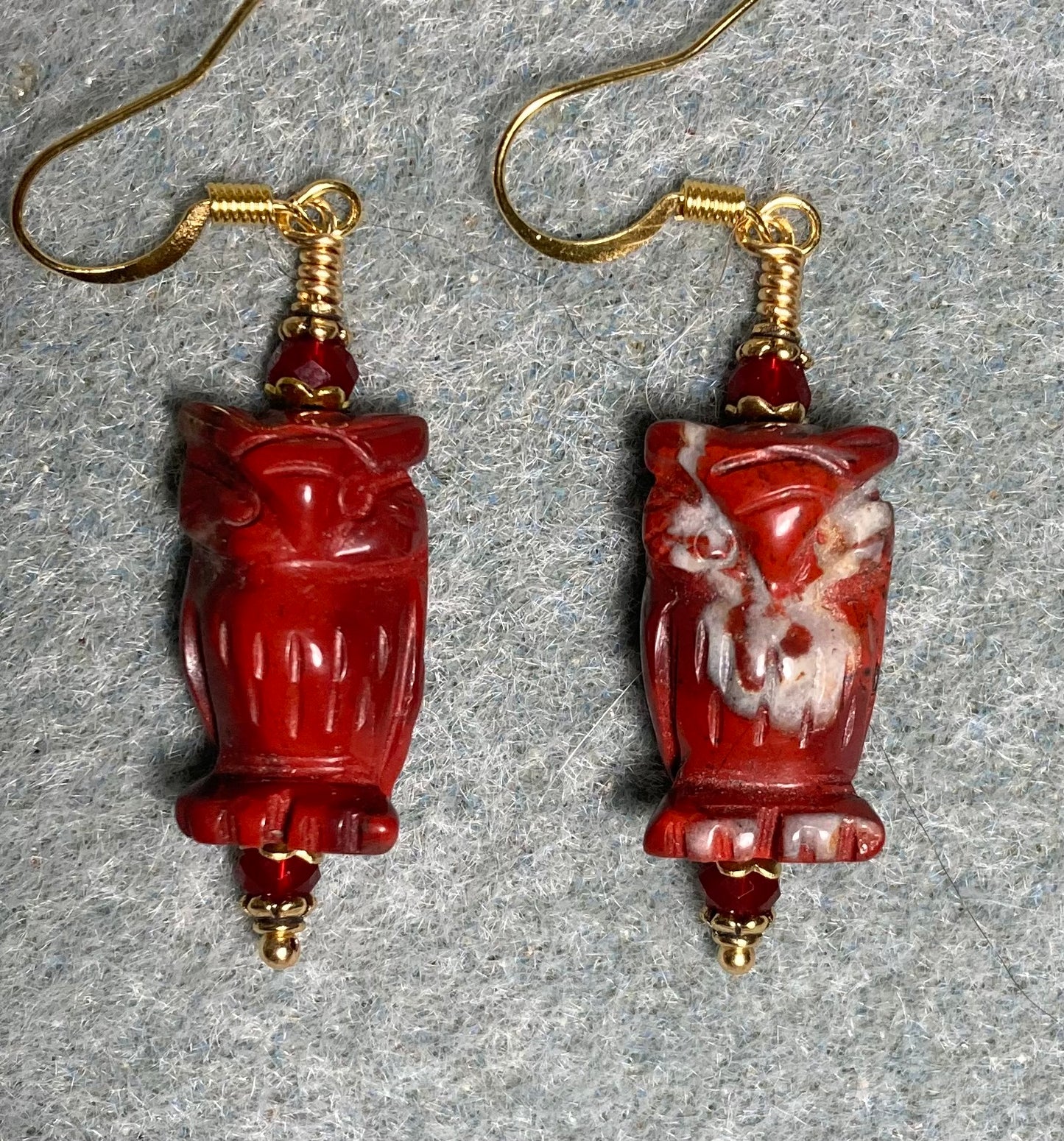 Red poppy jasper gemstone owl bead earrings adorned with dark red Chinese crystal beads.