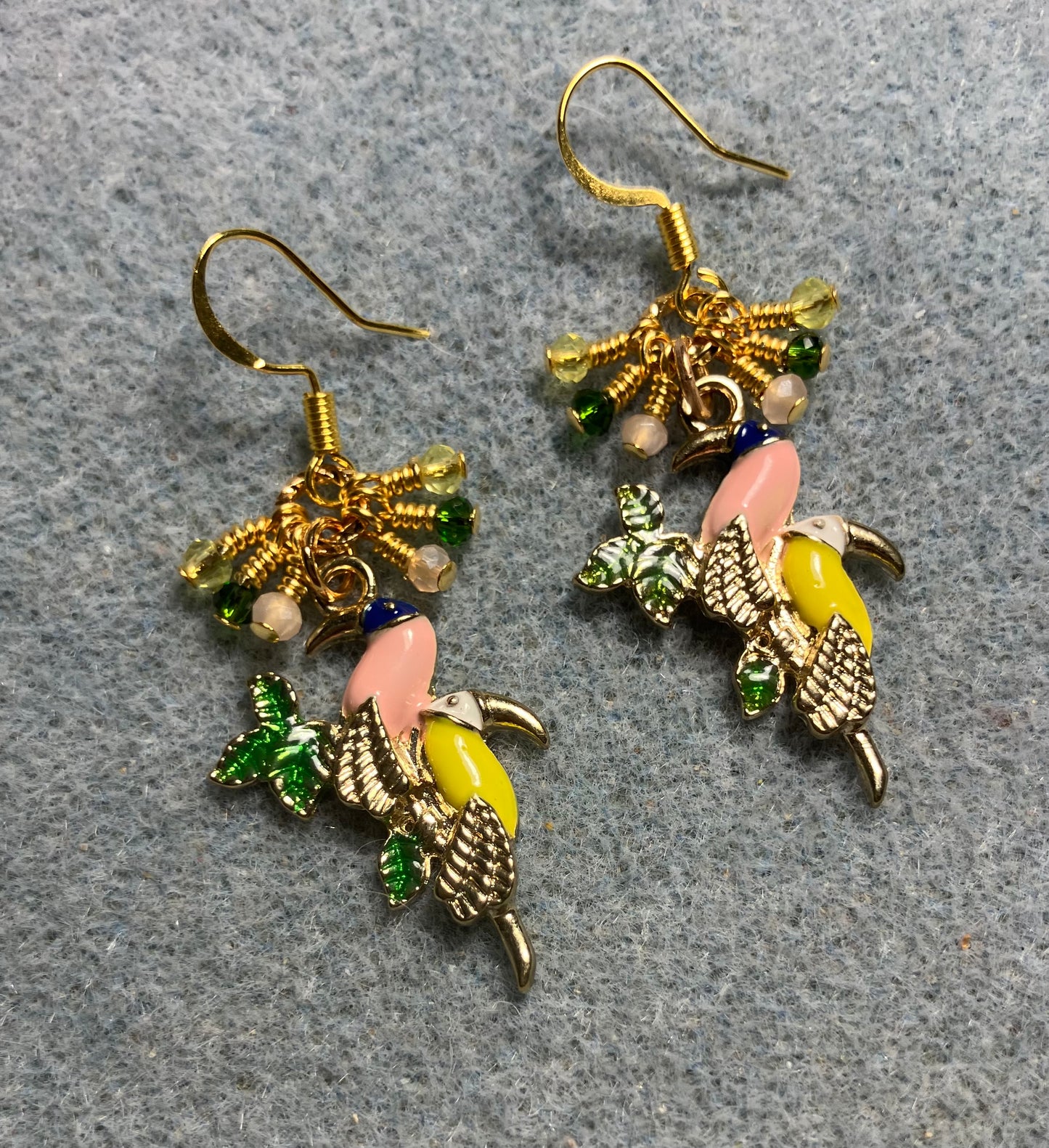 Peach, yellow, and green enamel toucan charm earrings adorned with tiny dangling peach, yellow, and green Chinese crystal beads.