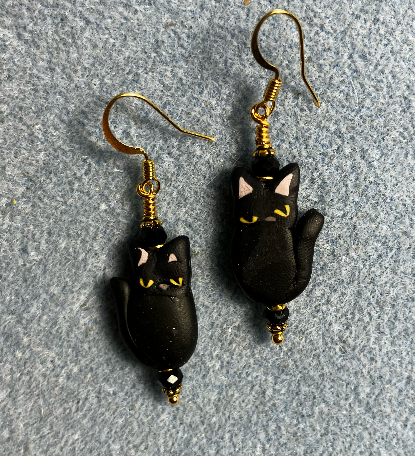 Black polymer clay cat bead earrings adorned with black Chinese crystal beads.