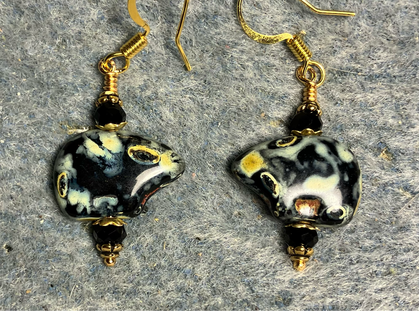 Black Picasso Czech glass bear bead earrings adorned with black Chinese crystal beads.