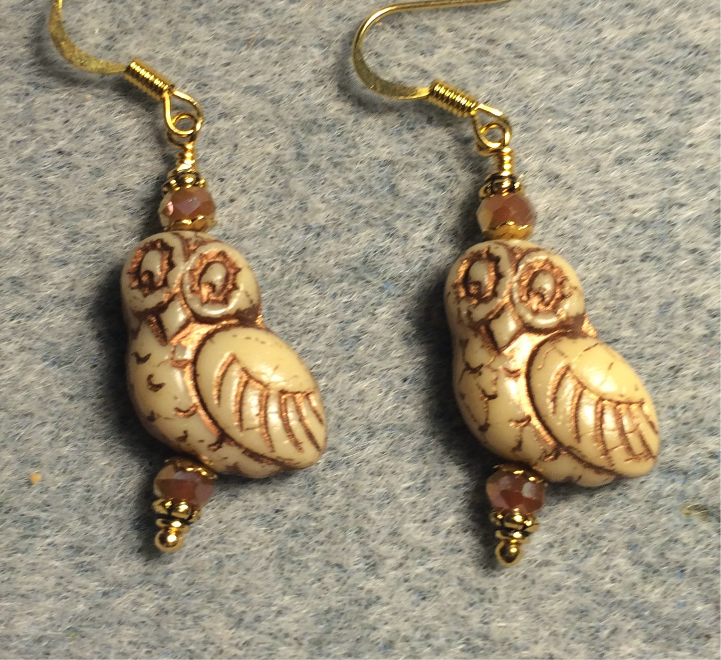 Tan (with copper wash) fancy Czech glass owl bead earrings adorned with tan Chinese crystal beads.