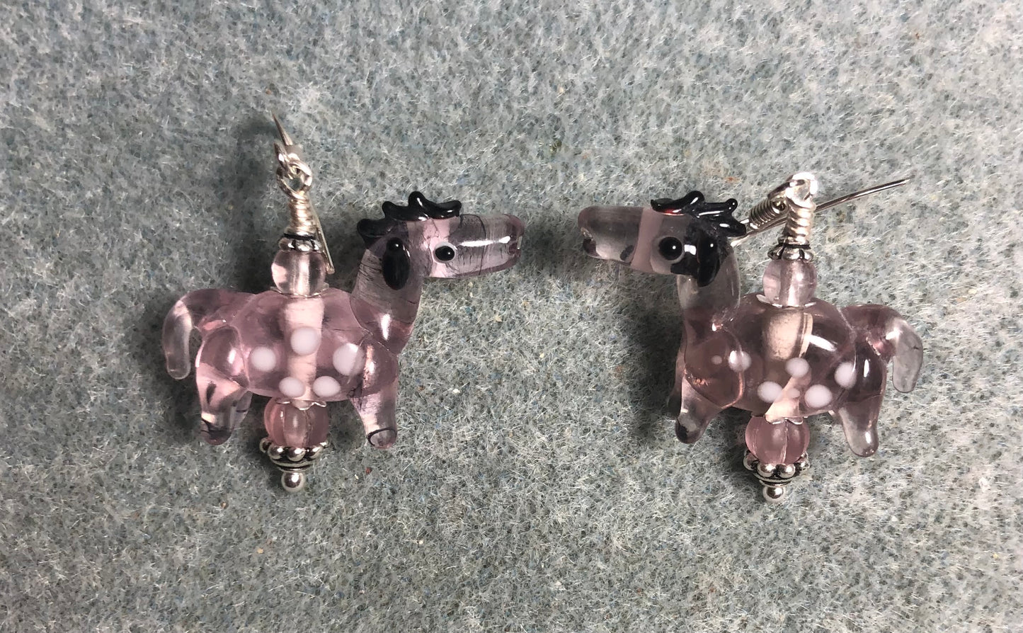 Translucent violet lamp work spotted horse bead earrings adorned with violet Czech glass beads.