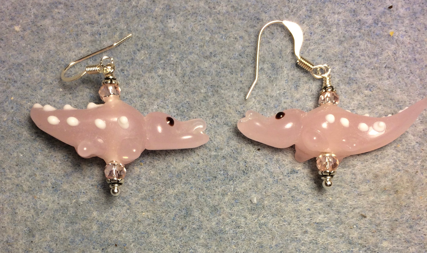 Milky pink lamp work spotted alligator bead earrings adorned with pink Chinese crystal beads.