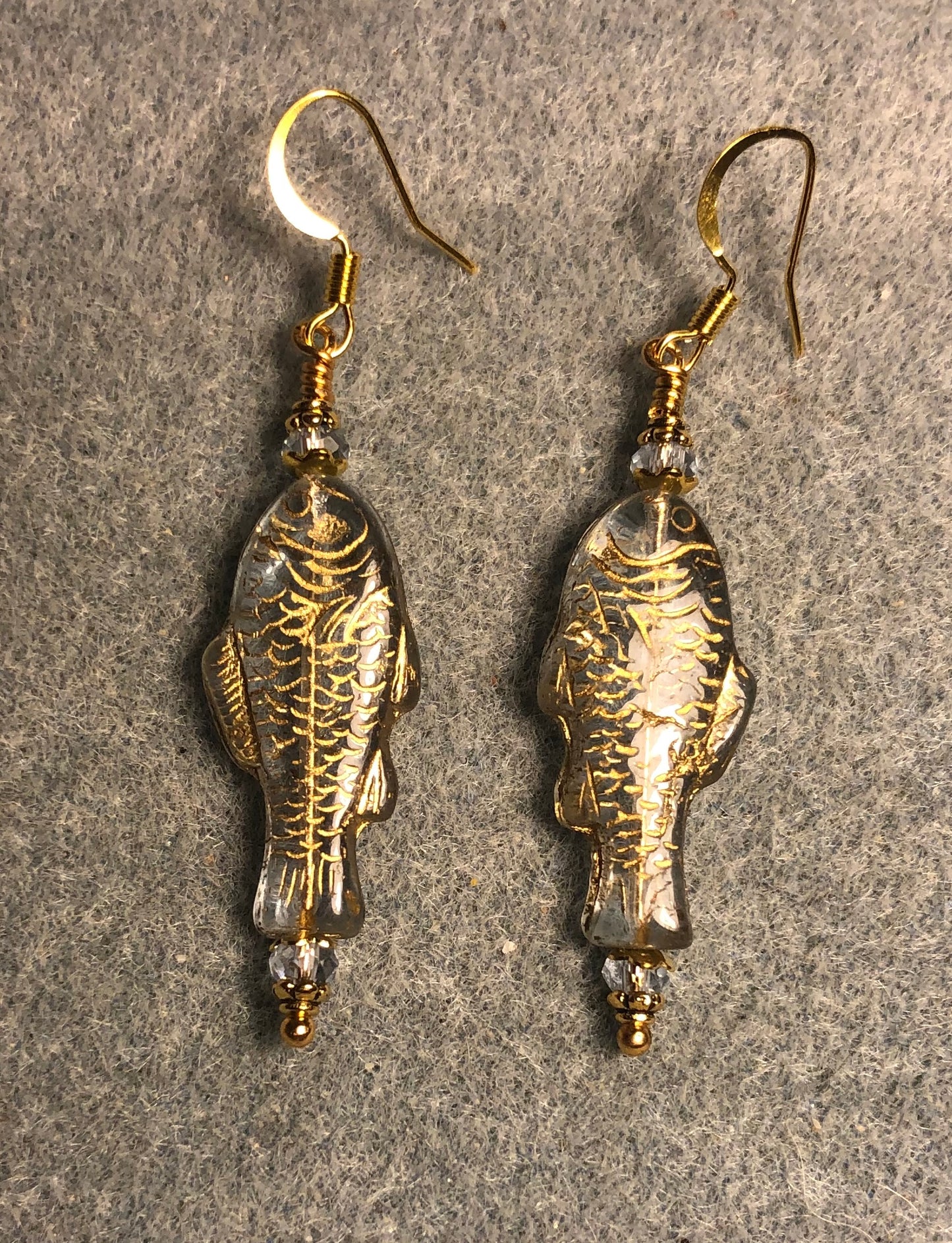 Light blue (with gold inlay) Czech glass fish bead earrings adorned with light blue Chinese crystal beads.